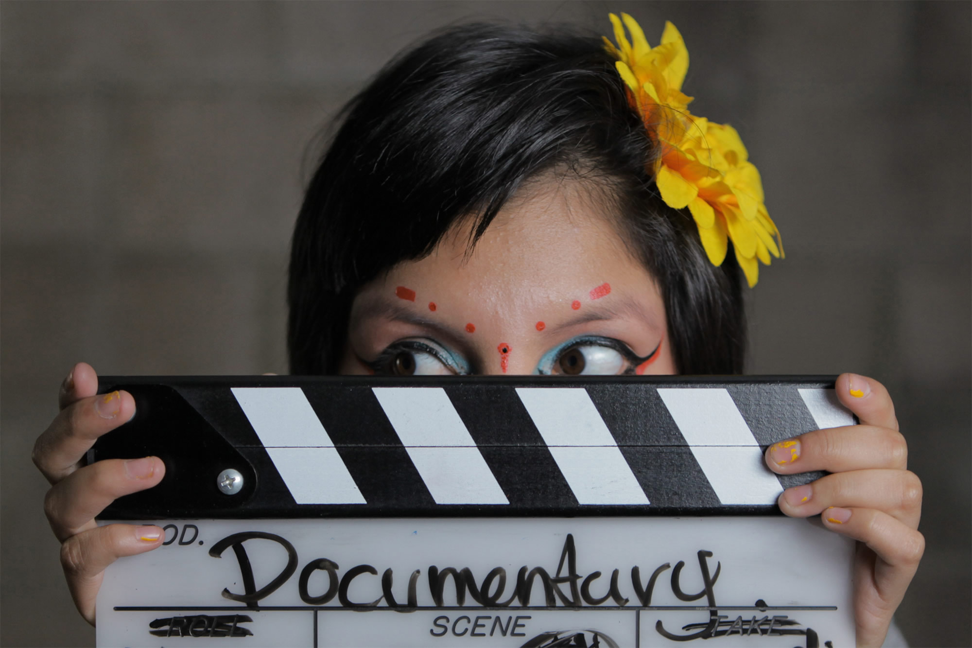 inocente movie, documentary, social good. girl holding film clipboard