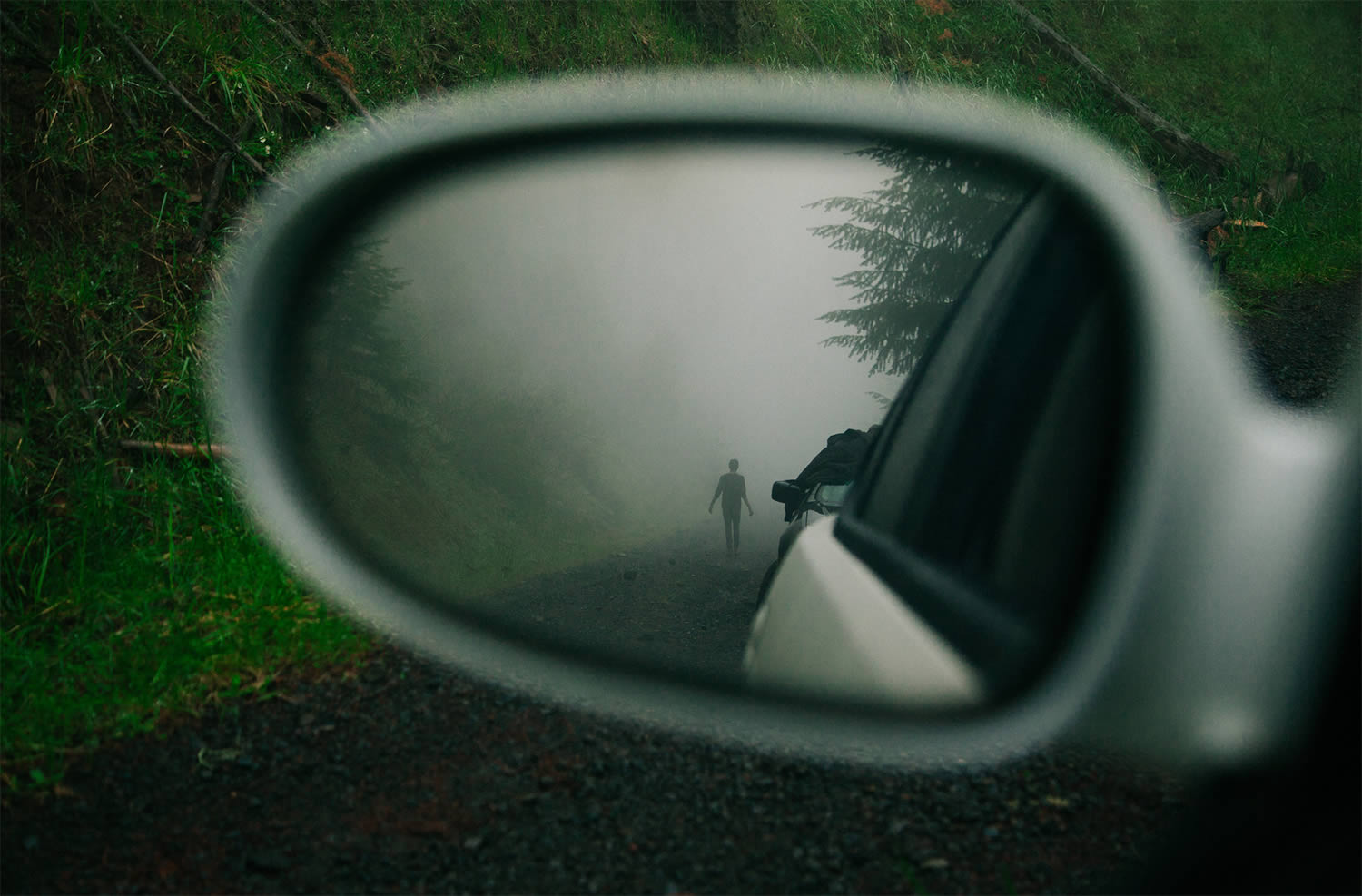person reflected in car mirror, brendon burton