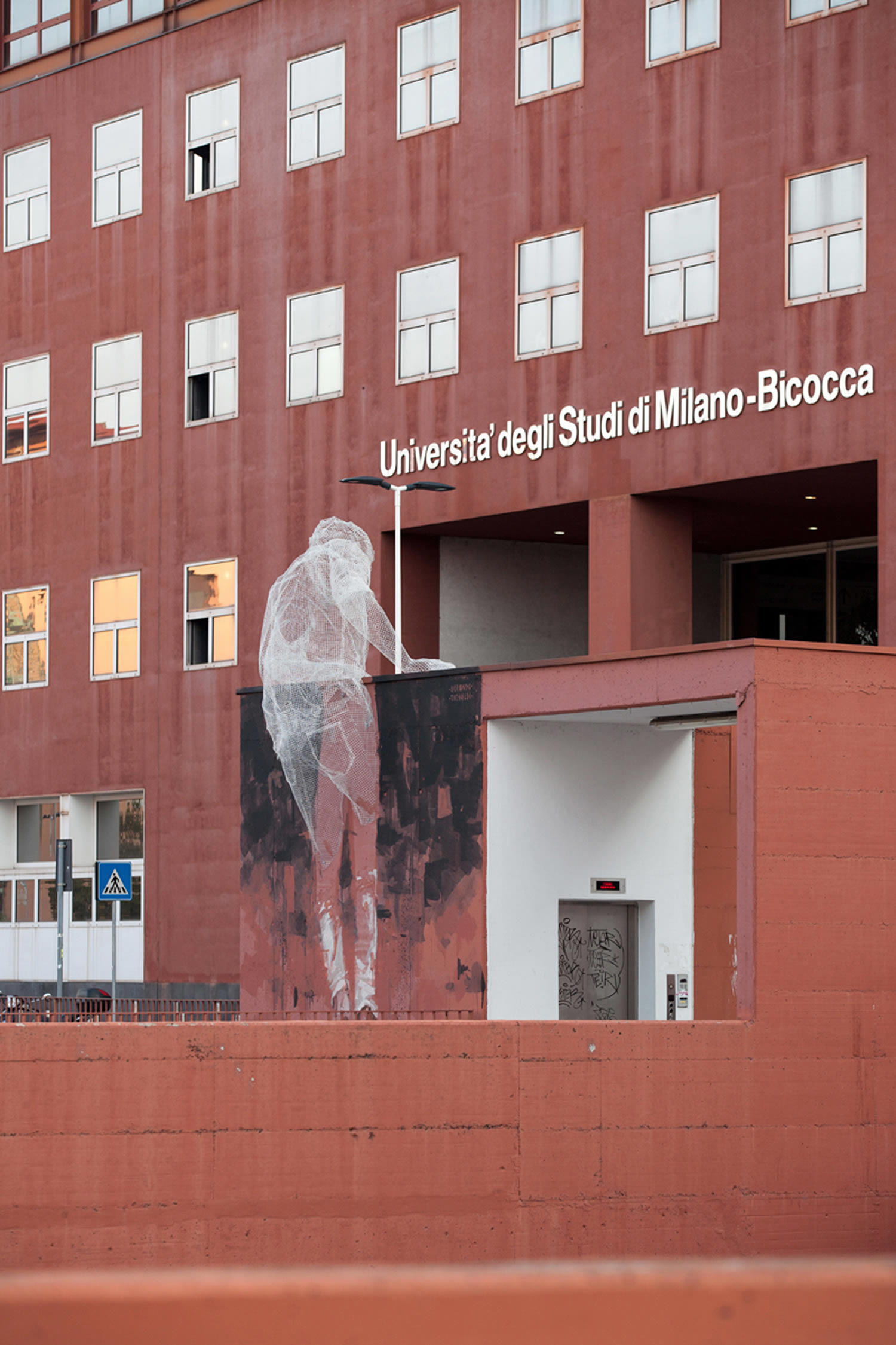 wired sculpture of man, mural