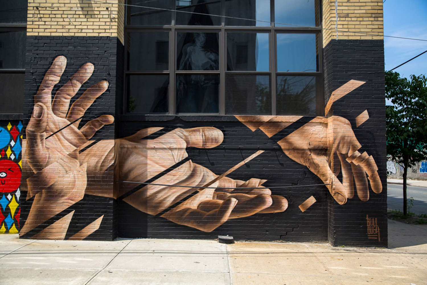 segmented hands mural by james bullough