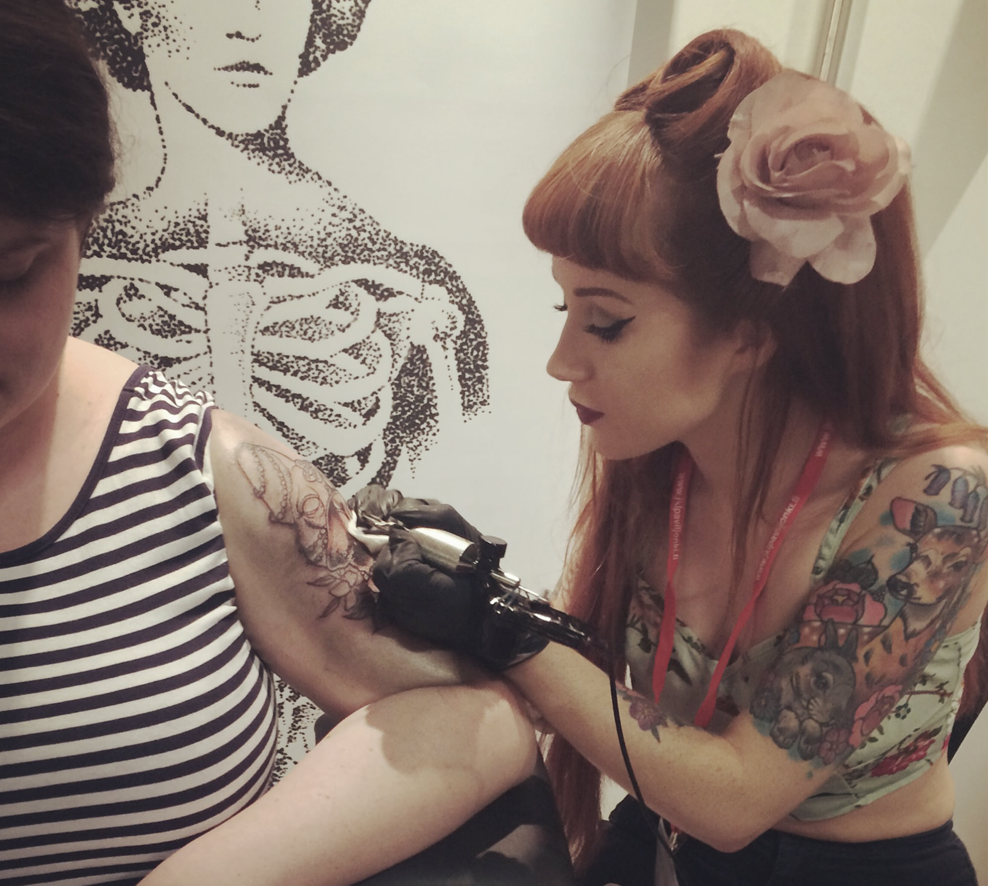sophie brown tattooing a client