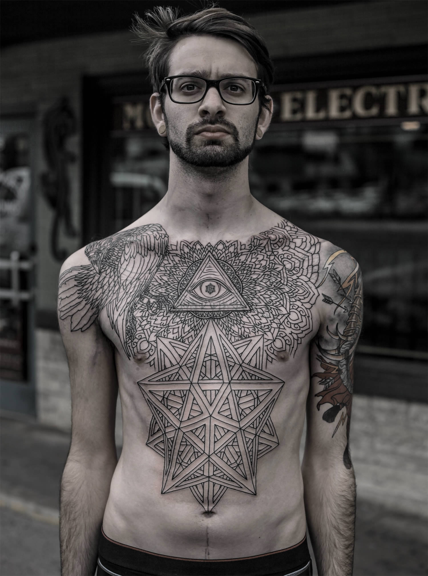 Eye of providence in tattoo chest piece by thomas hooper