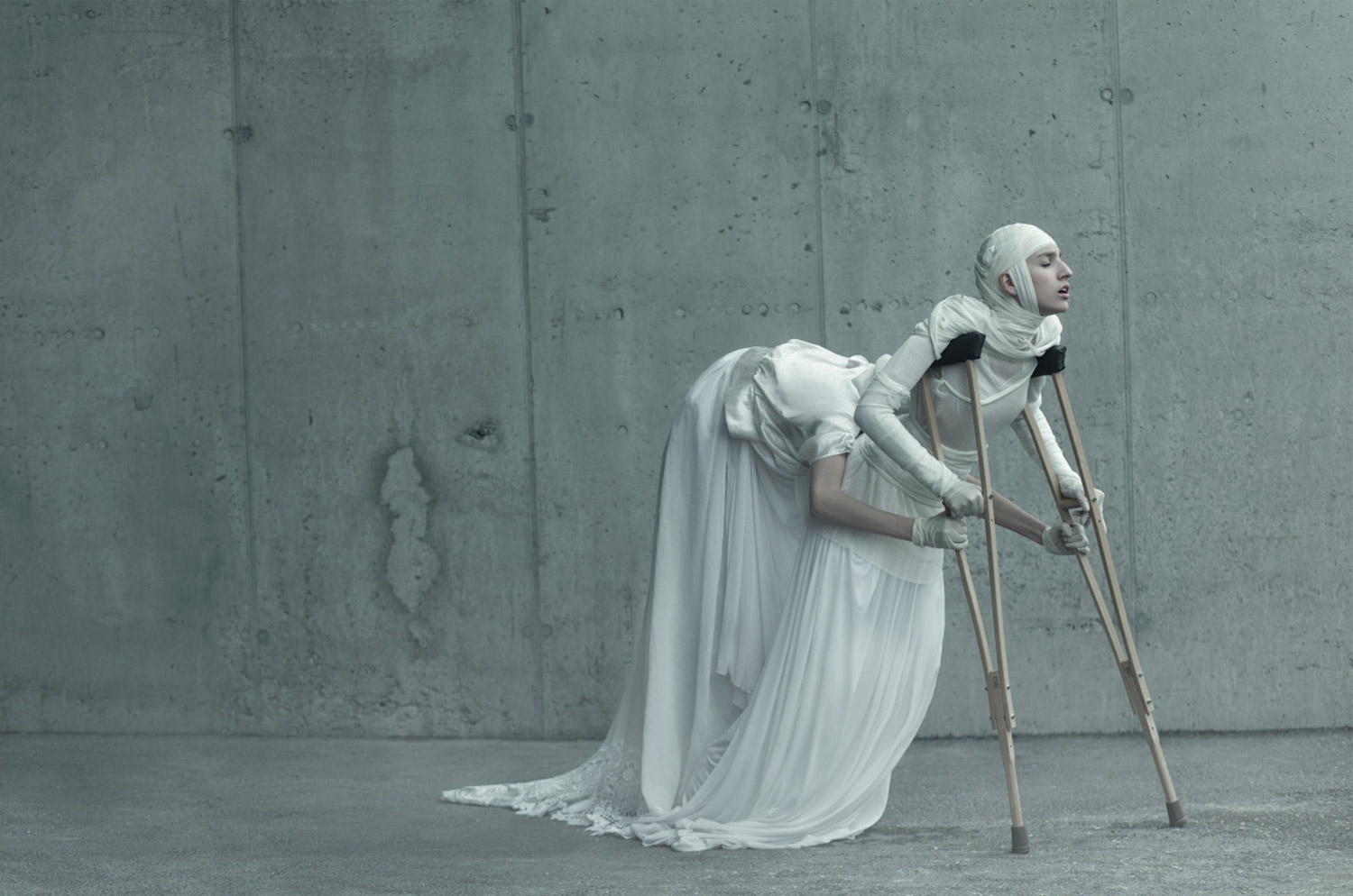 Evelyn Bencicova, Black and White Magic, surreal photo of multi-armed woman on crutches.