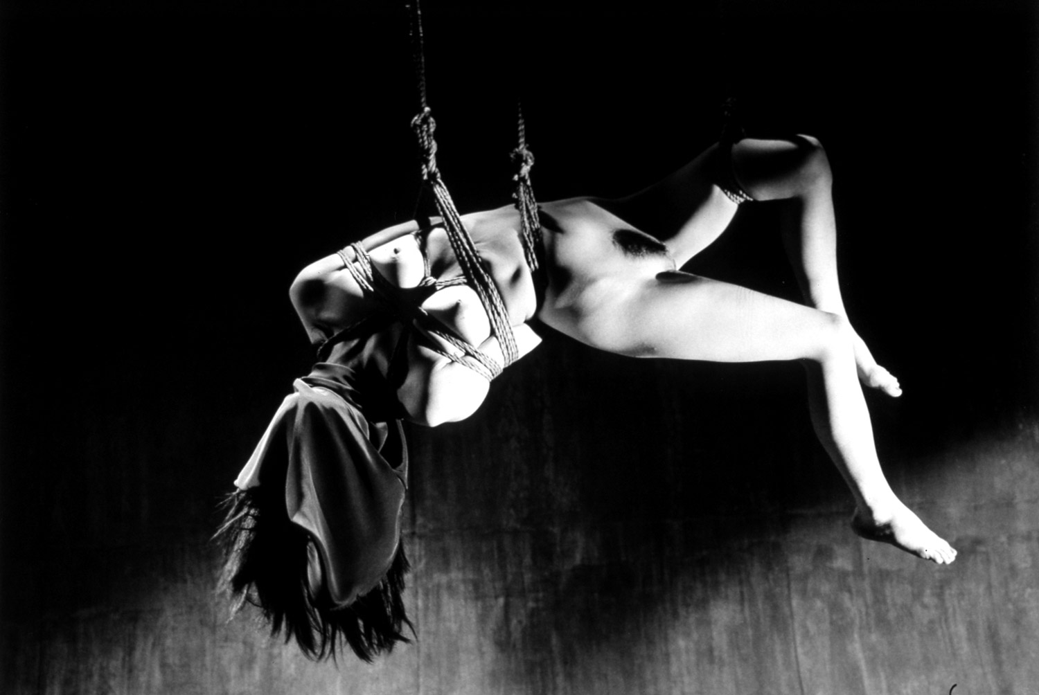 Nobuyoshi Araki, Kinbaku-bi, woman suspended and twisting in ropes