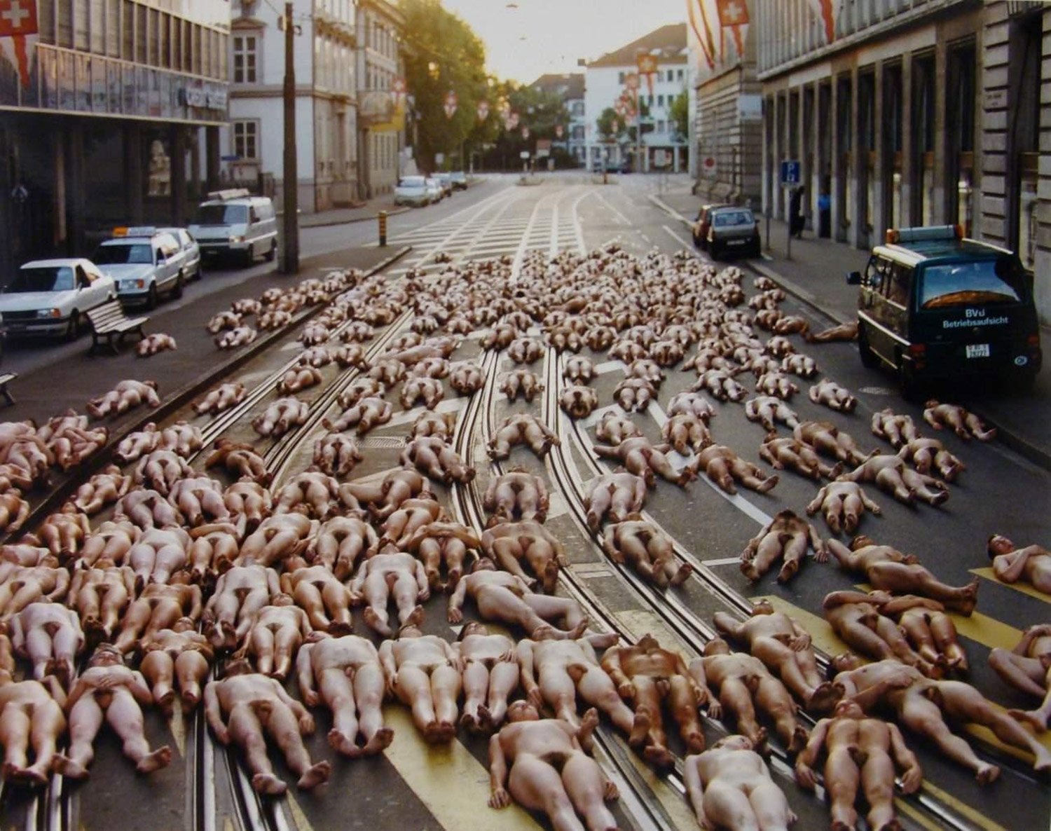 Spencer Tunick - nude bodies lying down in street in Basel, Switzerland