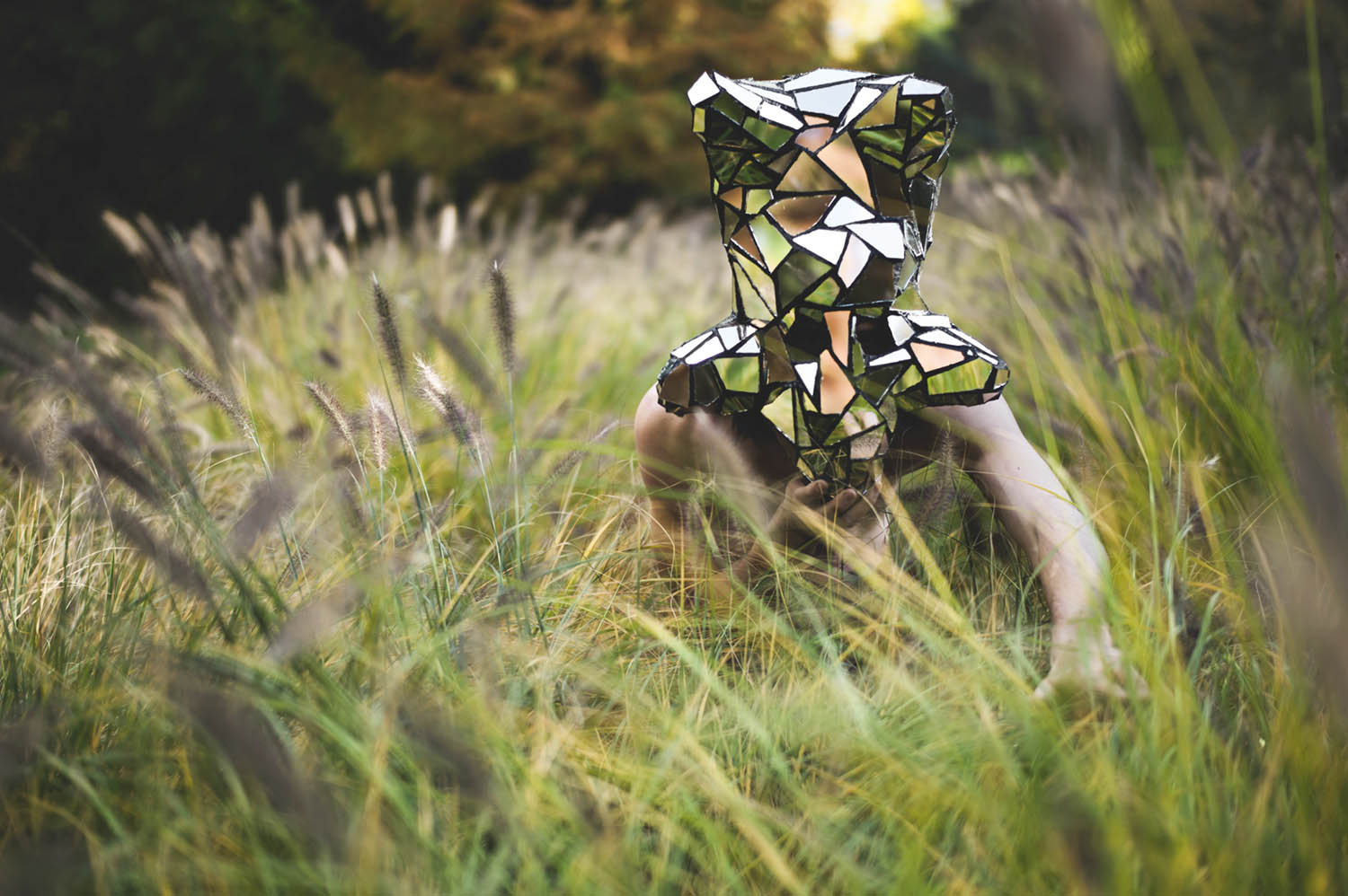 Leonard Condemine - iridescent masked figure in the grass