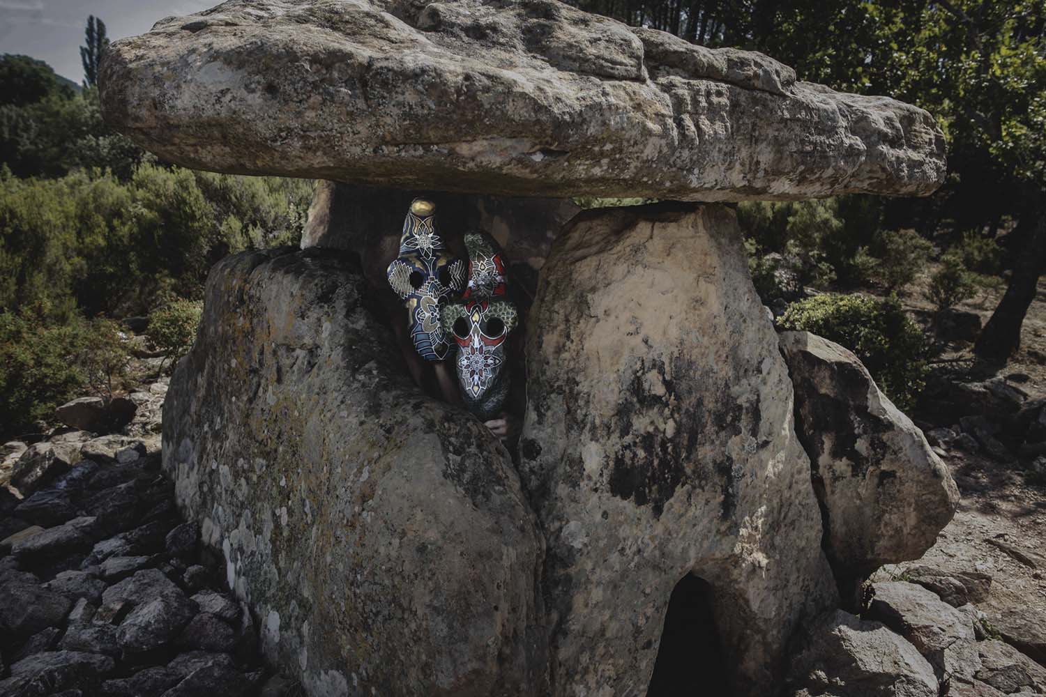 Leonard Condemine - two masked figures hiding between rocks