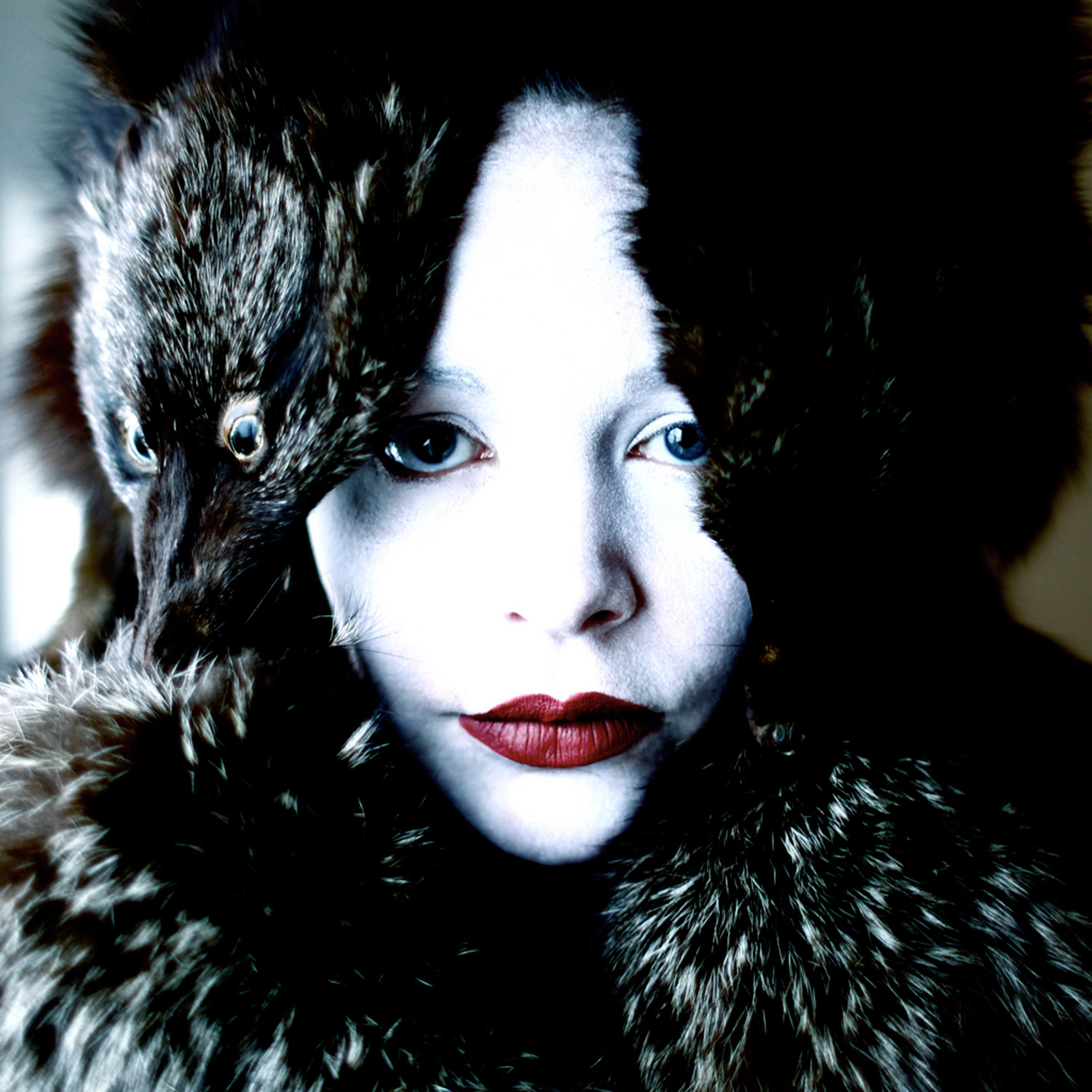 Helen Warner, Winter's Whisperer - woman with pale skin wearing fur