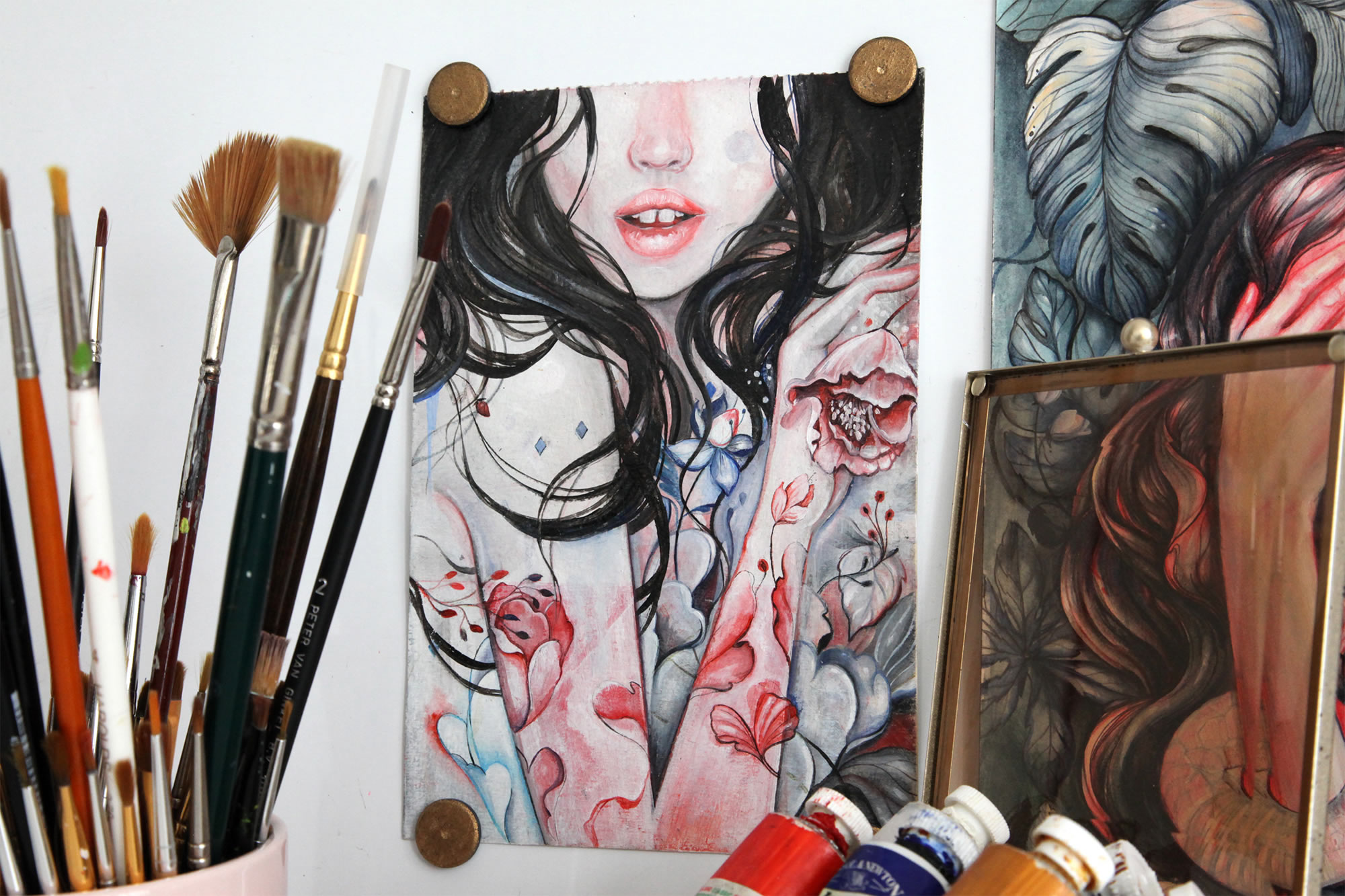 painting of tattooed girl, paintbrushes and paints