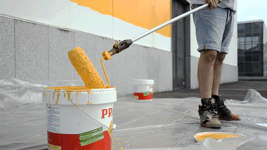 yellow paint in bucket