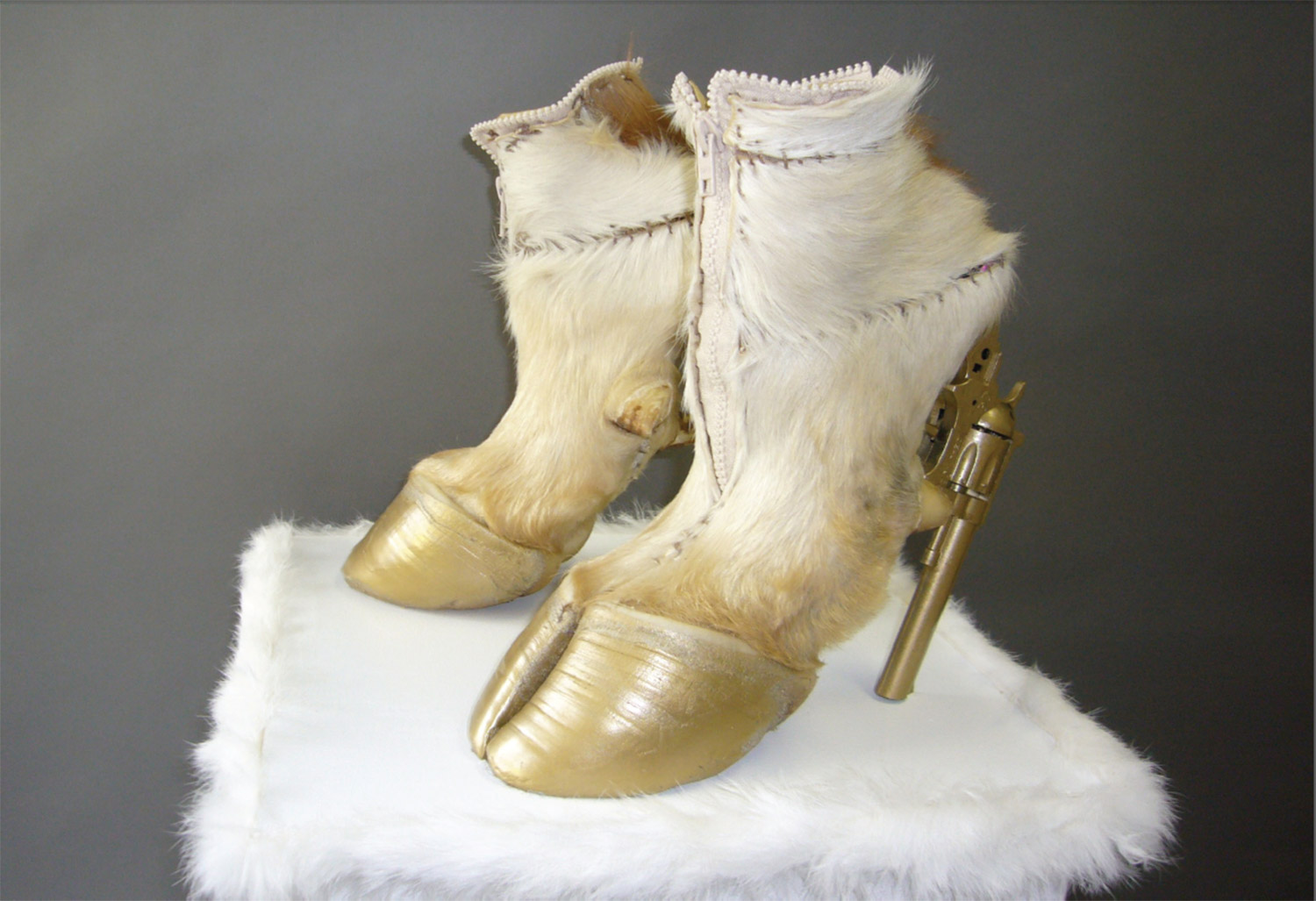 Iris Schieferstein - taxidermy couture, hoof heels with gold guns side angle