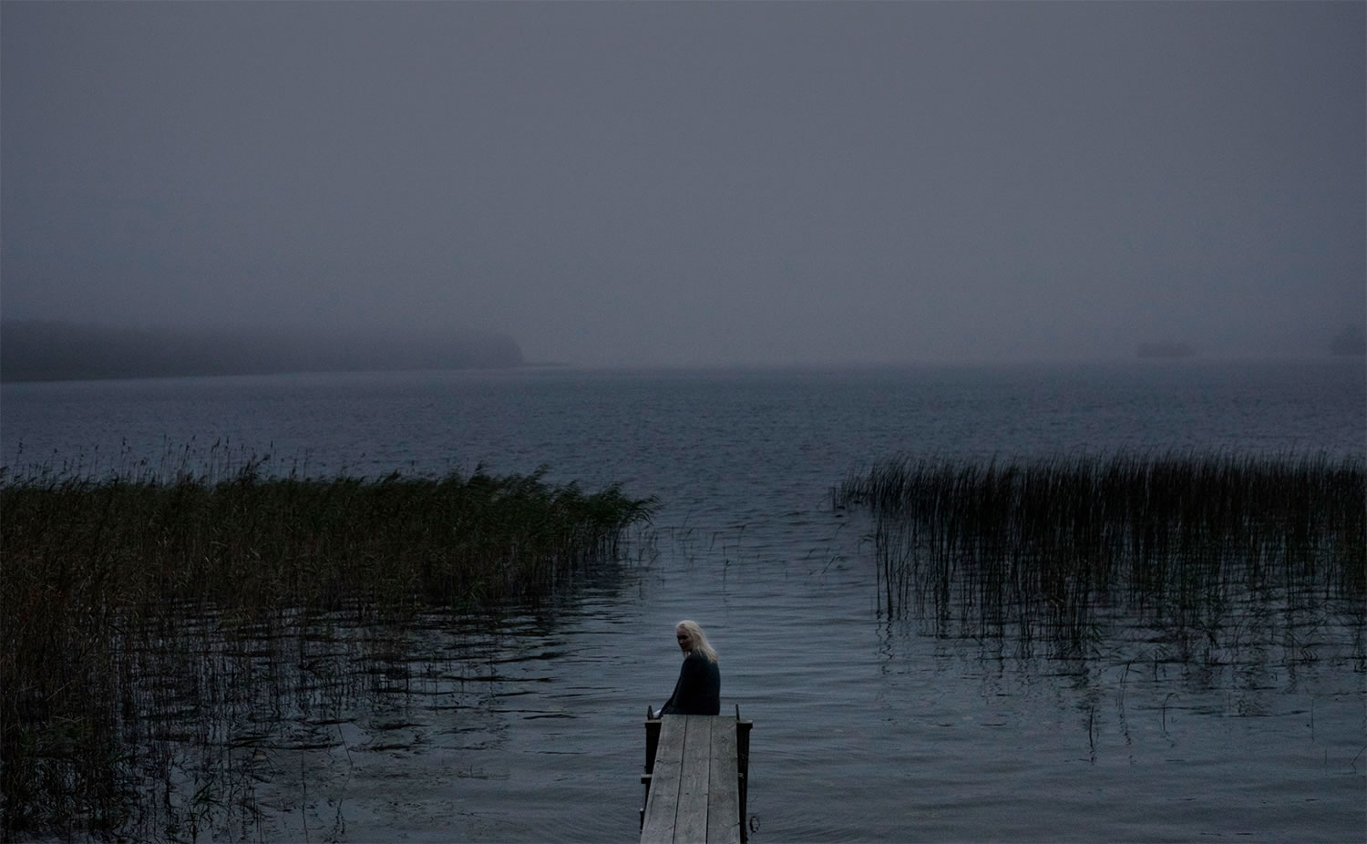 girl sitting on dock, water flowing, Shelley movie