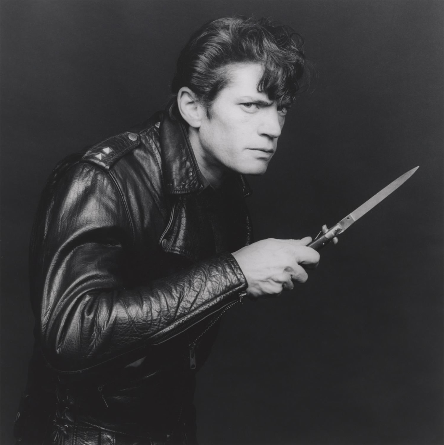 self-portrait, leather jacket and knife