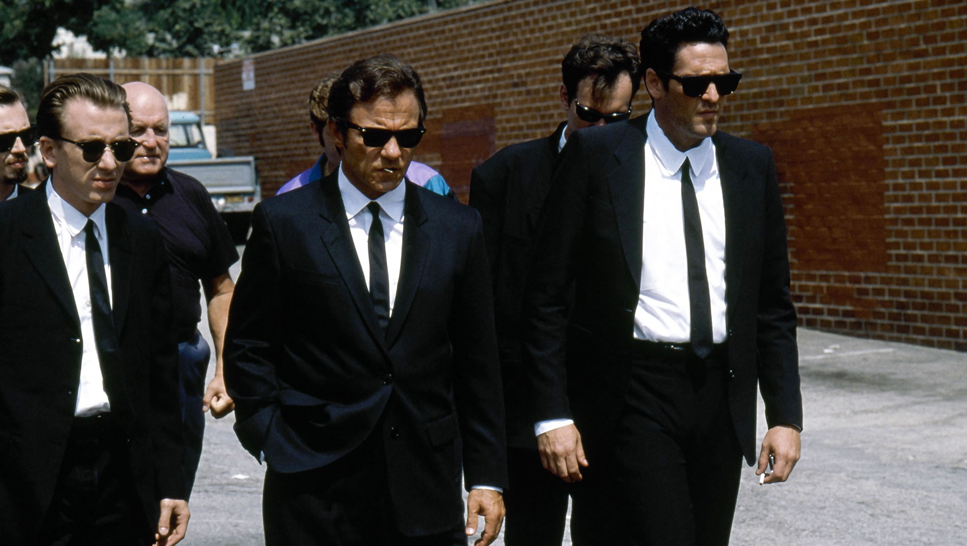 eight men dressed in black suits, reservoir dogs