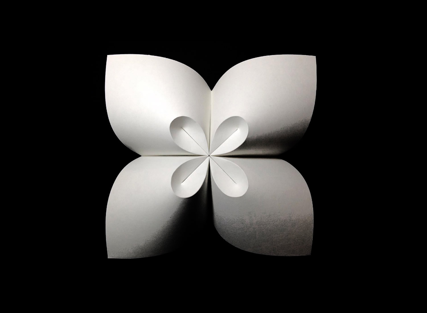 white cloverleaf origami by robby kraft, inspired by David Huffman