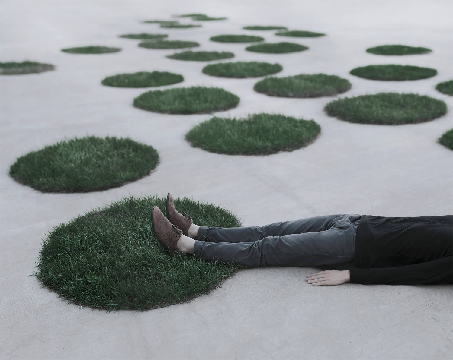 man lying on ground. photography