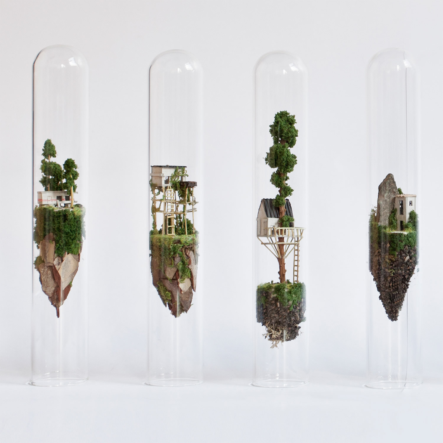 miniature sculptures in glass test tubes