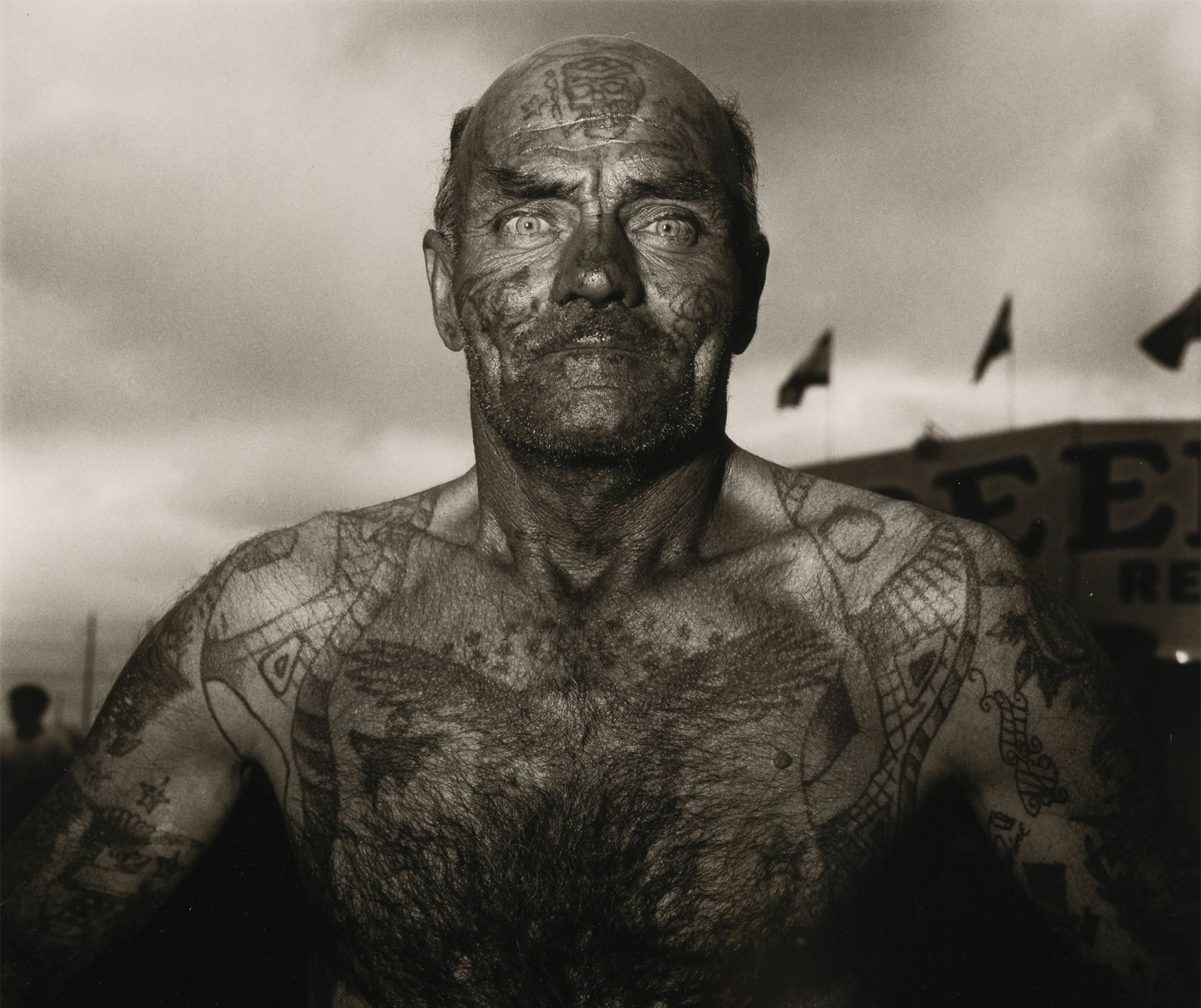 Tattooed man at a Maryland carnival, 1970.