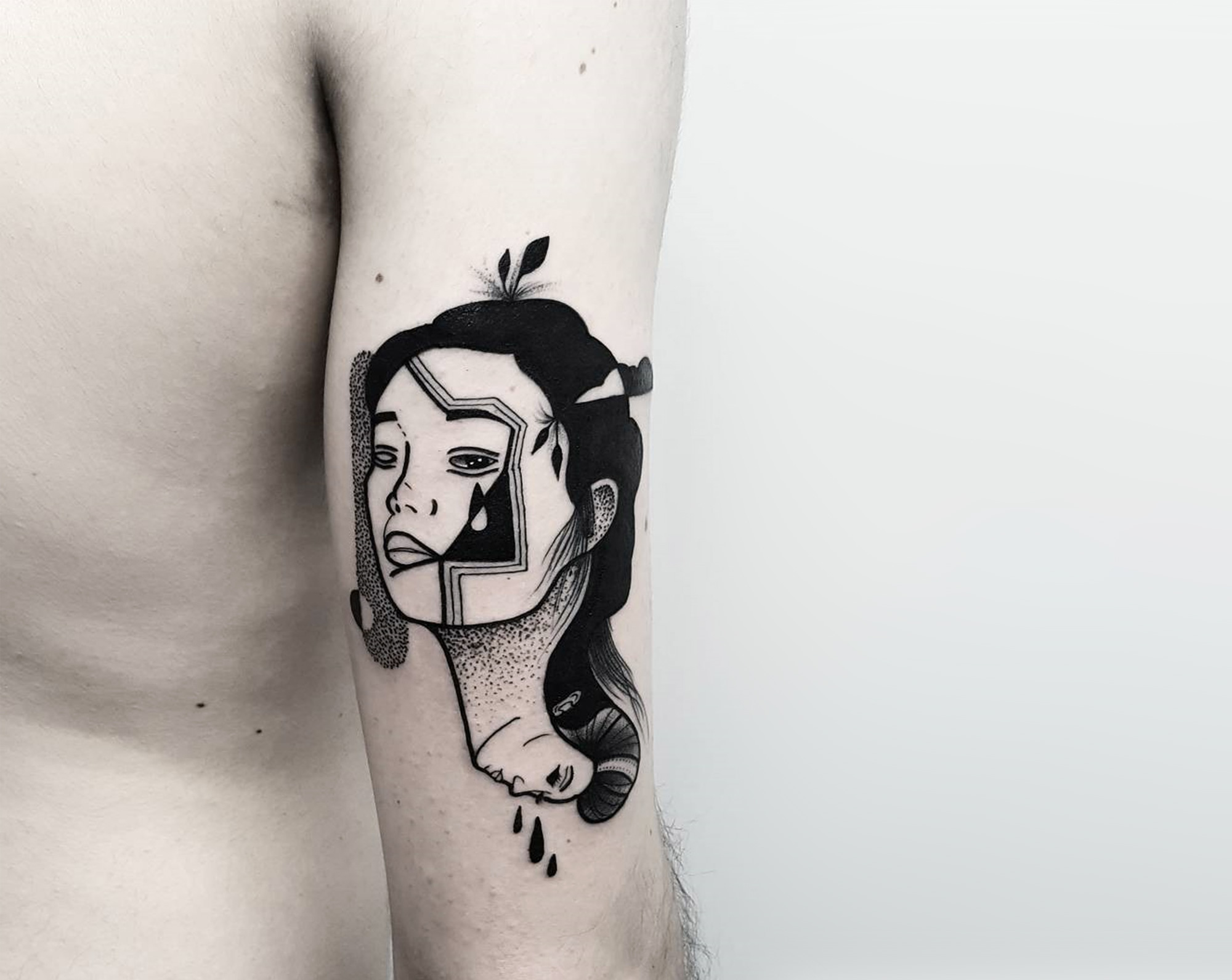 surreal double portrait on back arm by matteo nangeroni