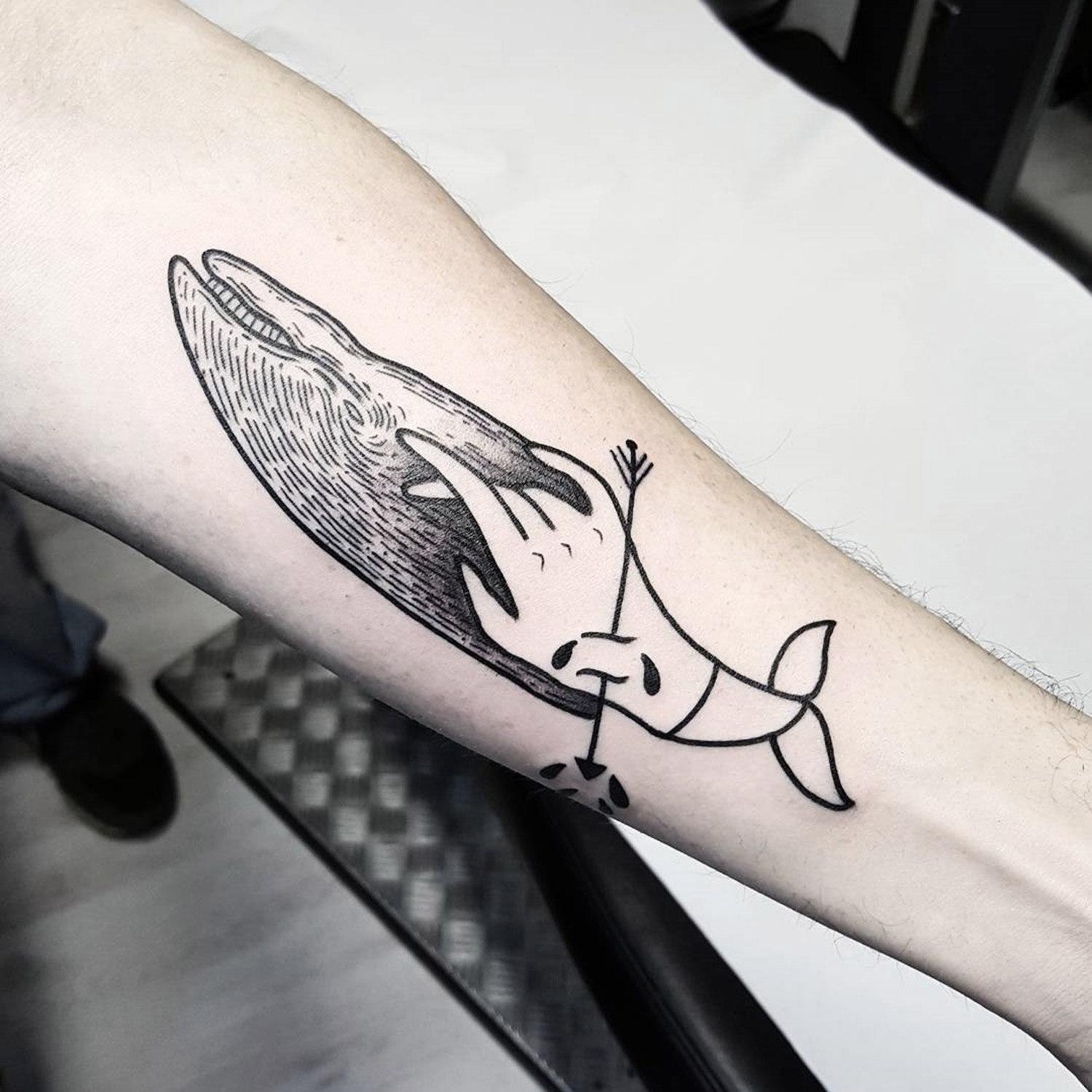 hand acting as tail of whale on an arm by matteo nangeroni