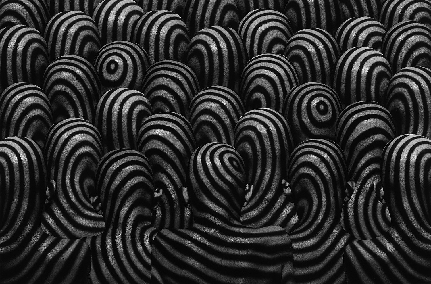 Misha Gordin - crowd with swirl patterns on heads and backs