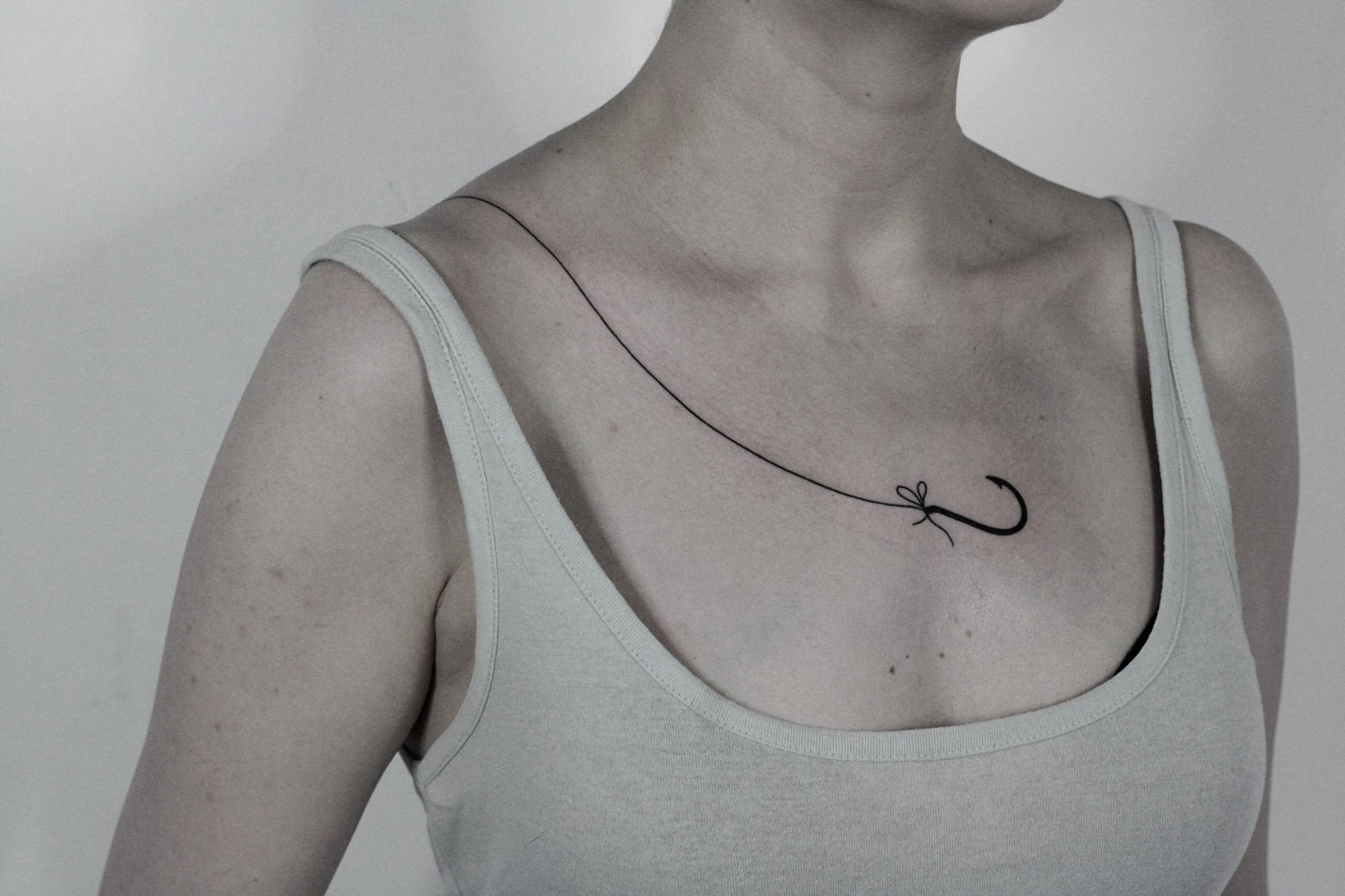 Hook tattoo across skin by ilya brezinski