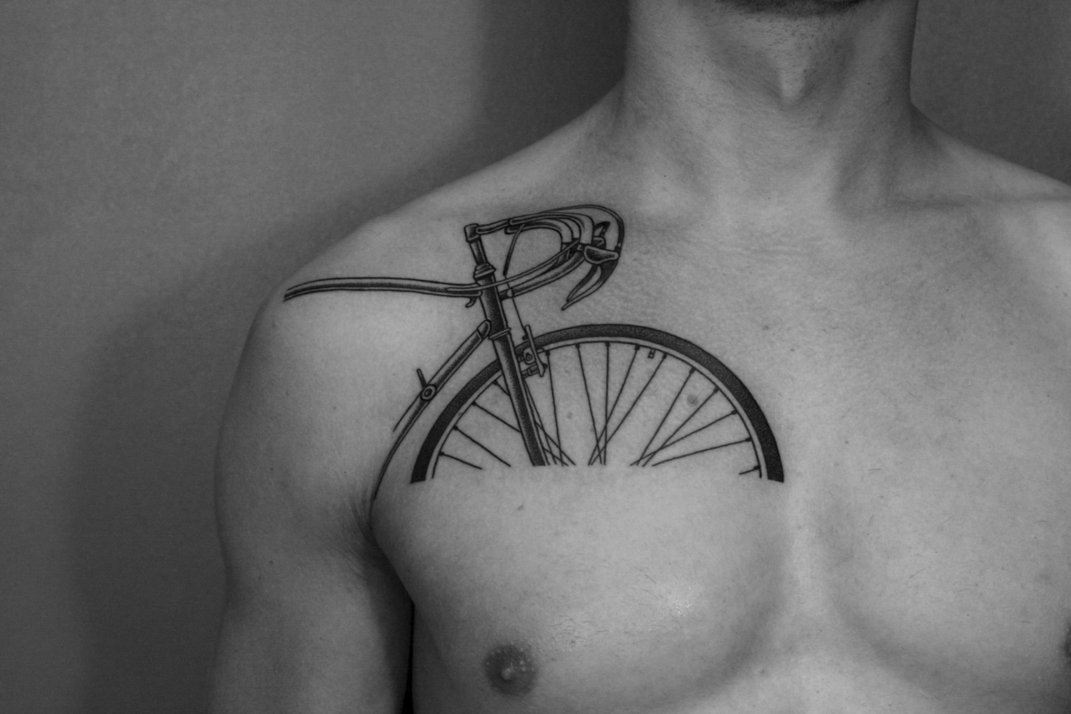 bicycle tattoo over chest
