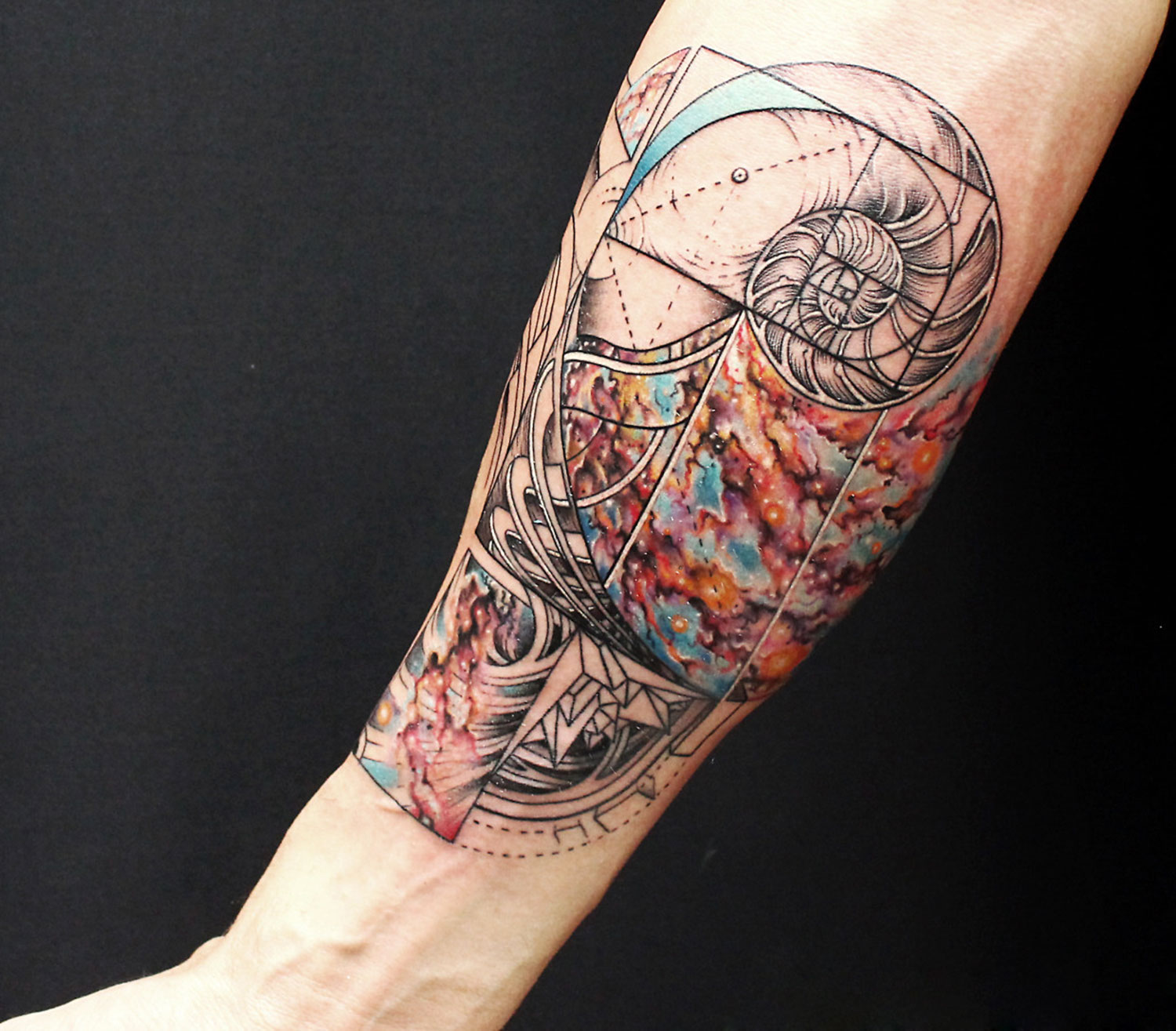 abstract tattoo on arm by nick broslavski