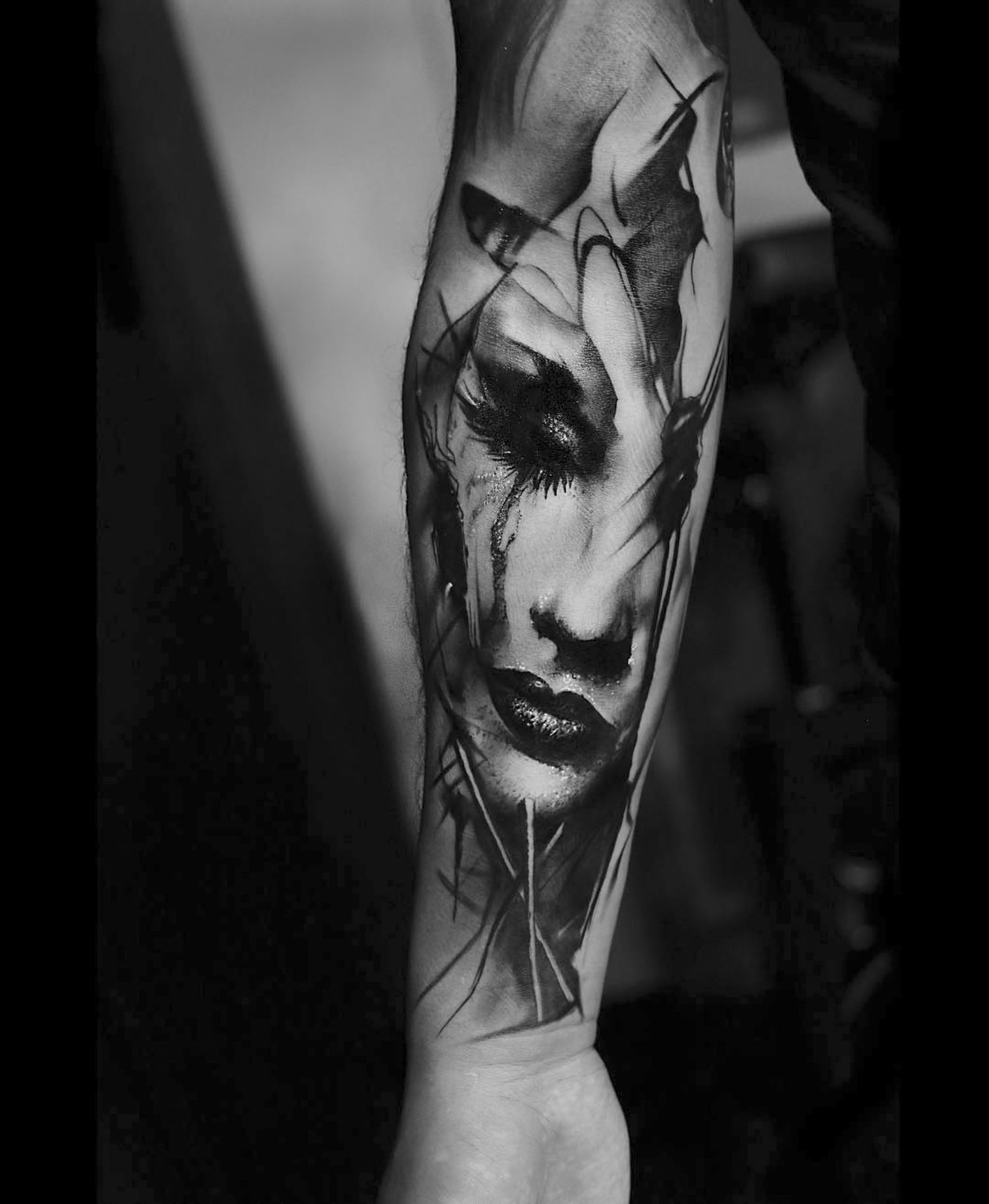 tattooed portrait on arm by kurt staudinger