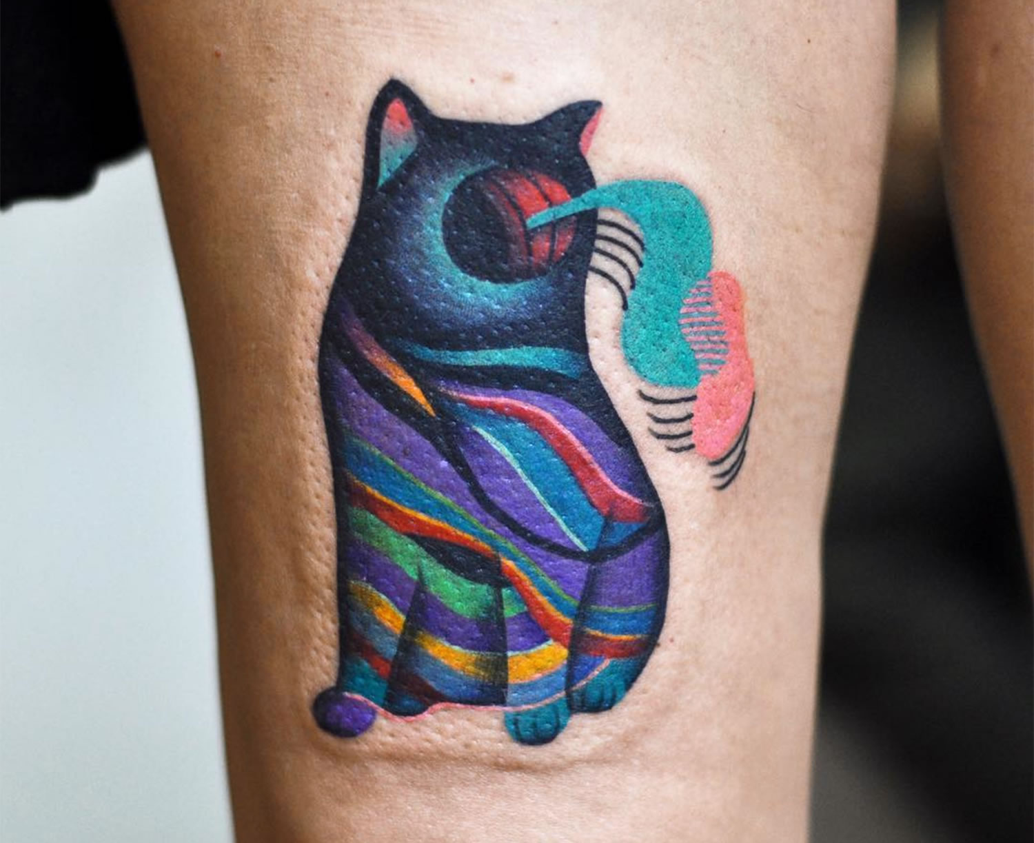 surreal psychedelic cat tattoo