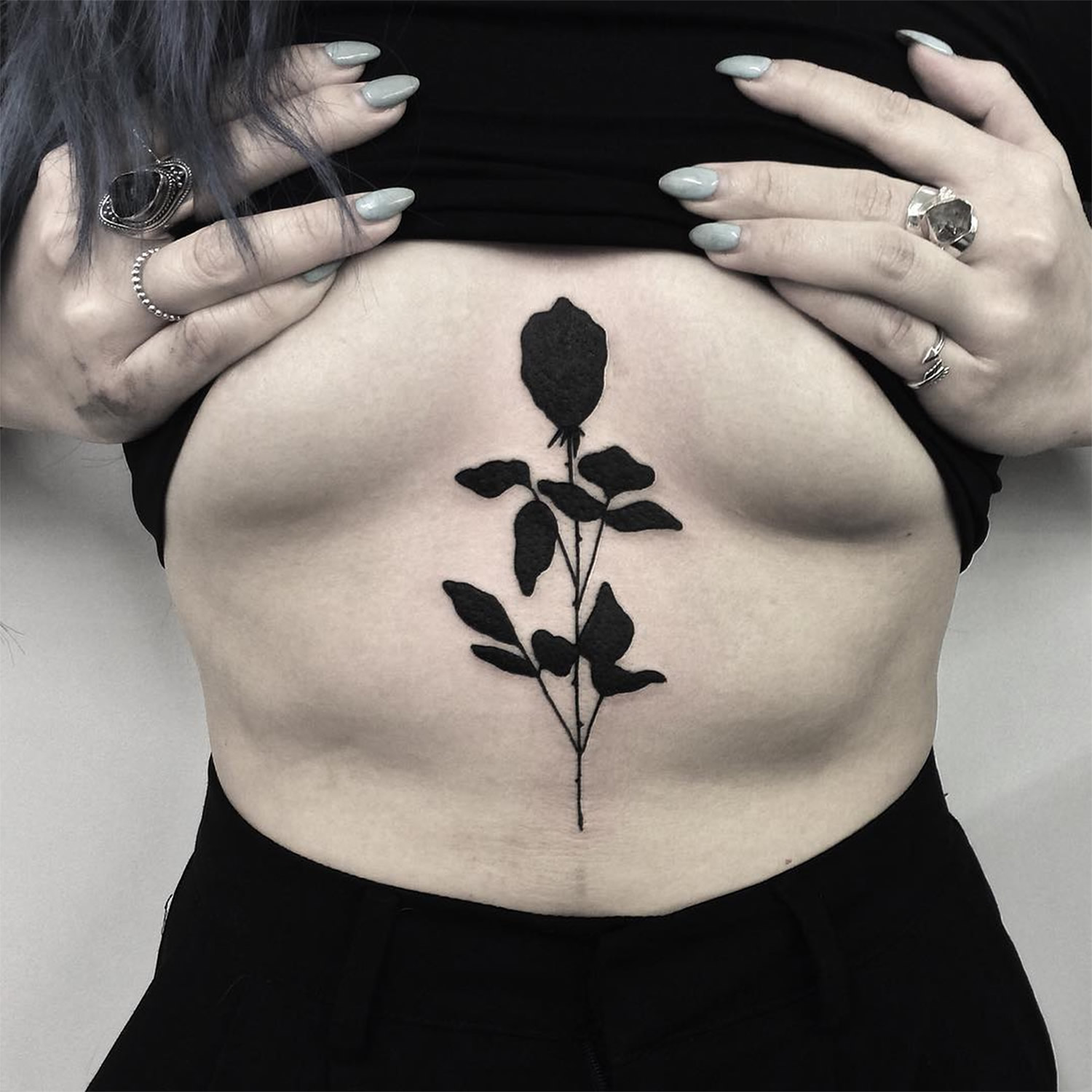 black rose tattoo on chest