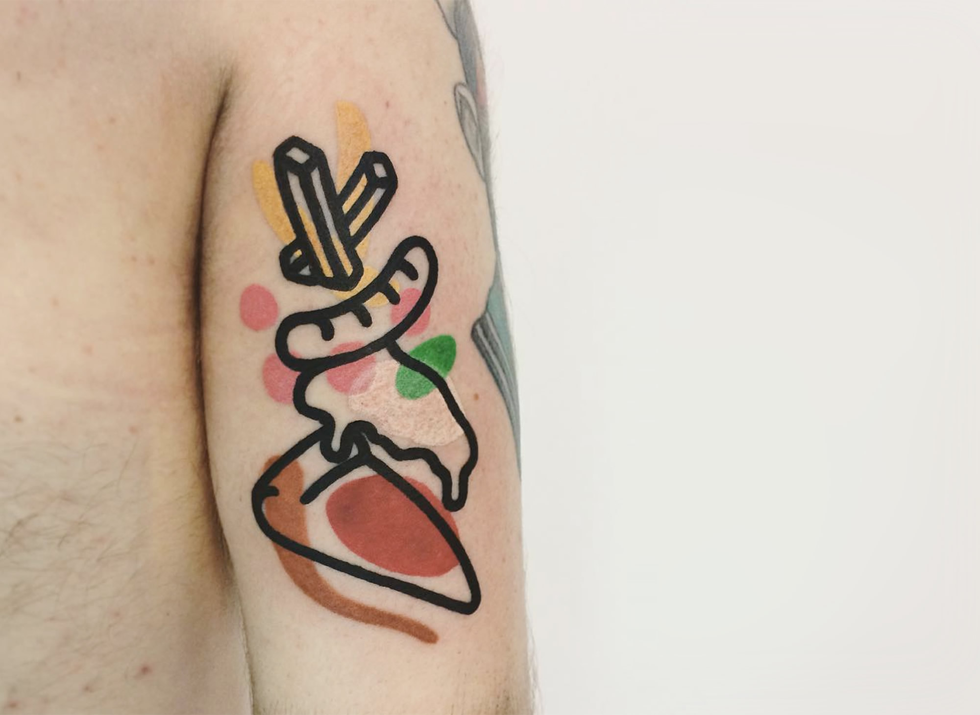 pizza tattoo on arm