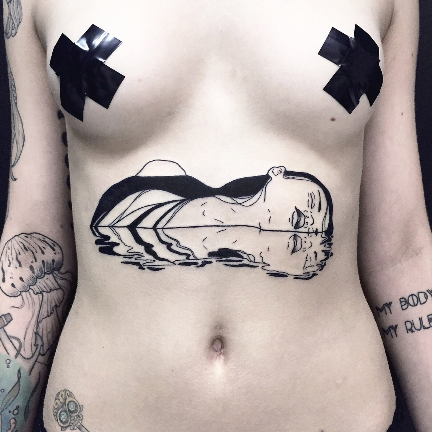 Silly Jane, Tattoo - woman floating sideways with reflection
