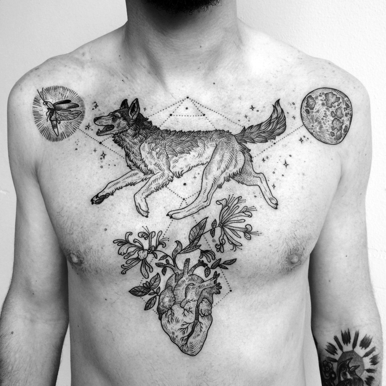 Triangular wolf tattoo by Pony Reinhardt