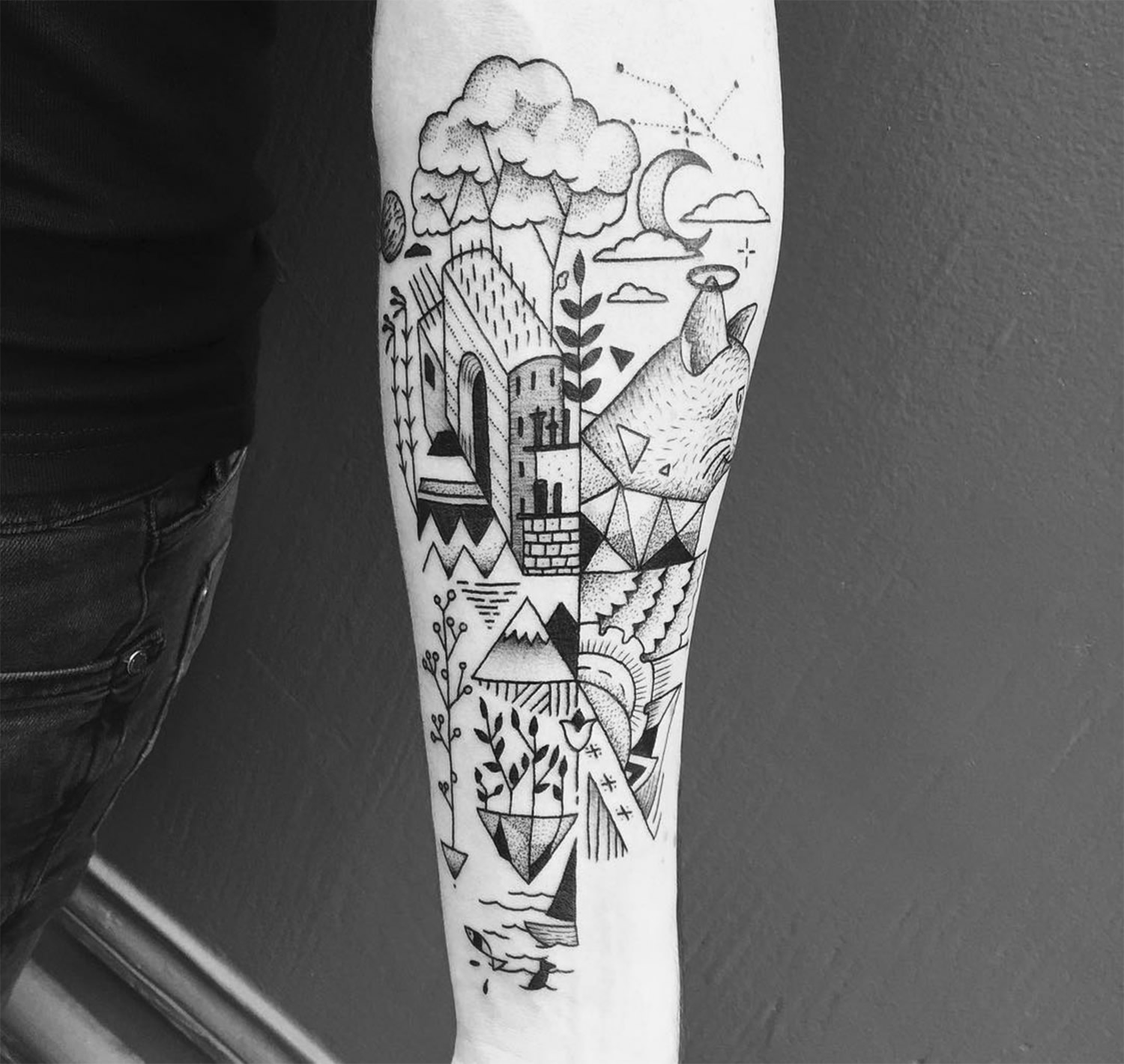 Tattoo composed of various landscape and geometric elements by Mast cora