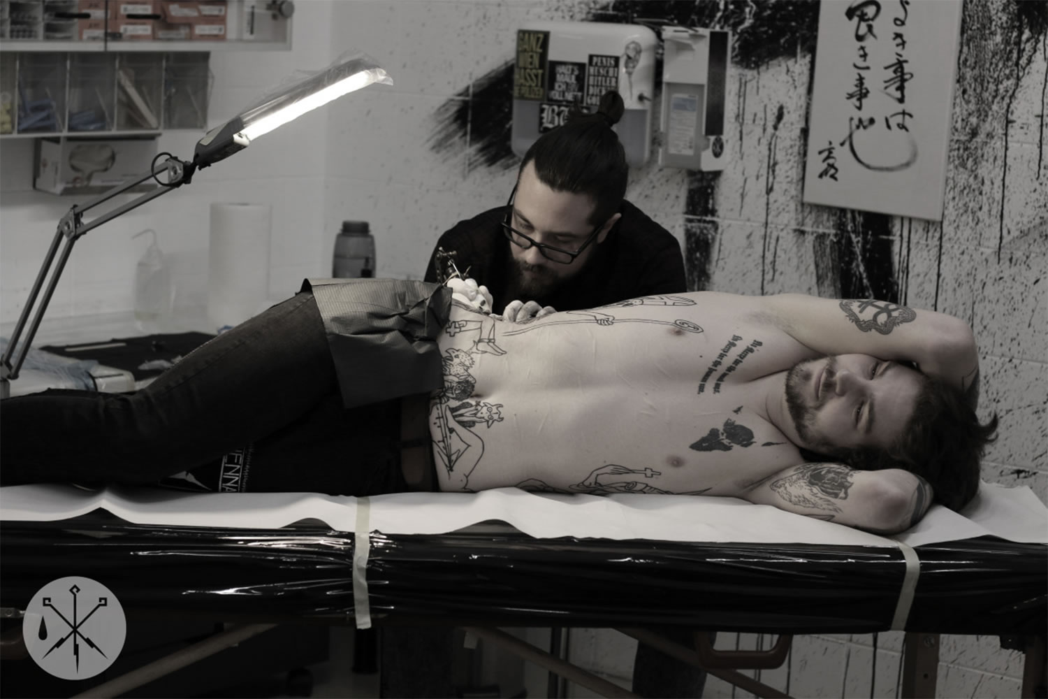 artist marian merl tattooing client