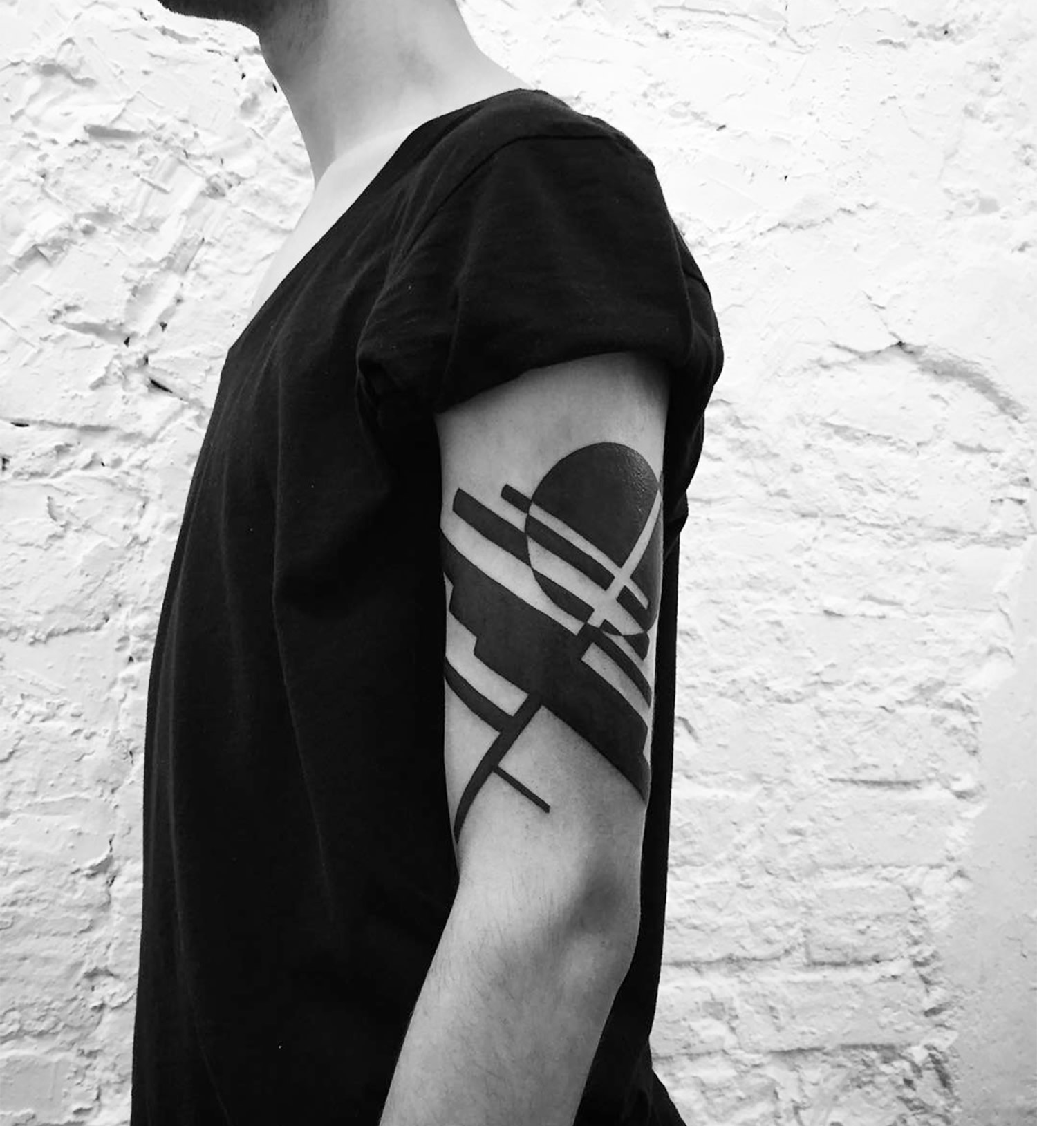 abstract black ink tattoo on arm