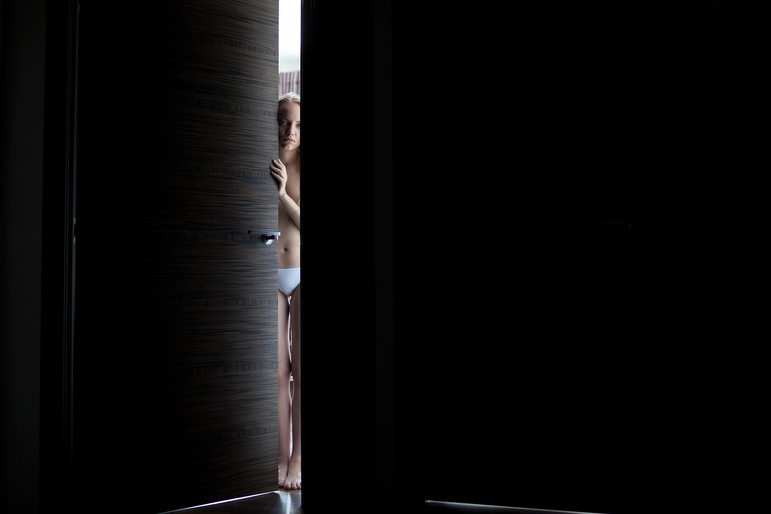 girl peeking through door, photography