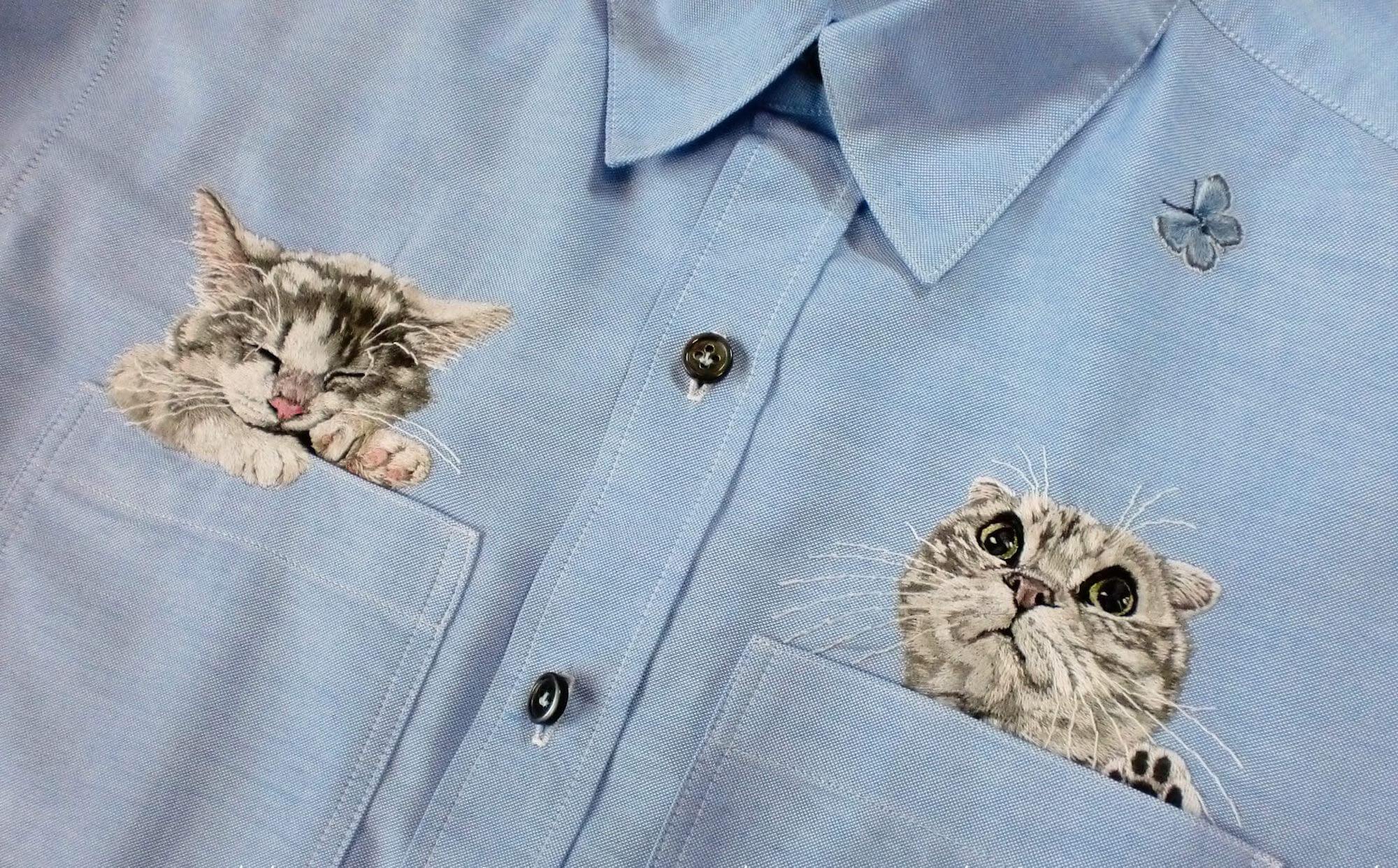 embroidered cats peeking out of shirt pockets by Hiroko Kubota