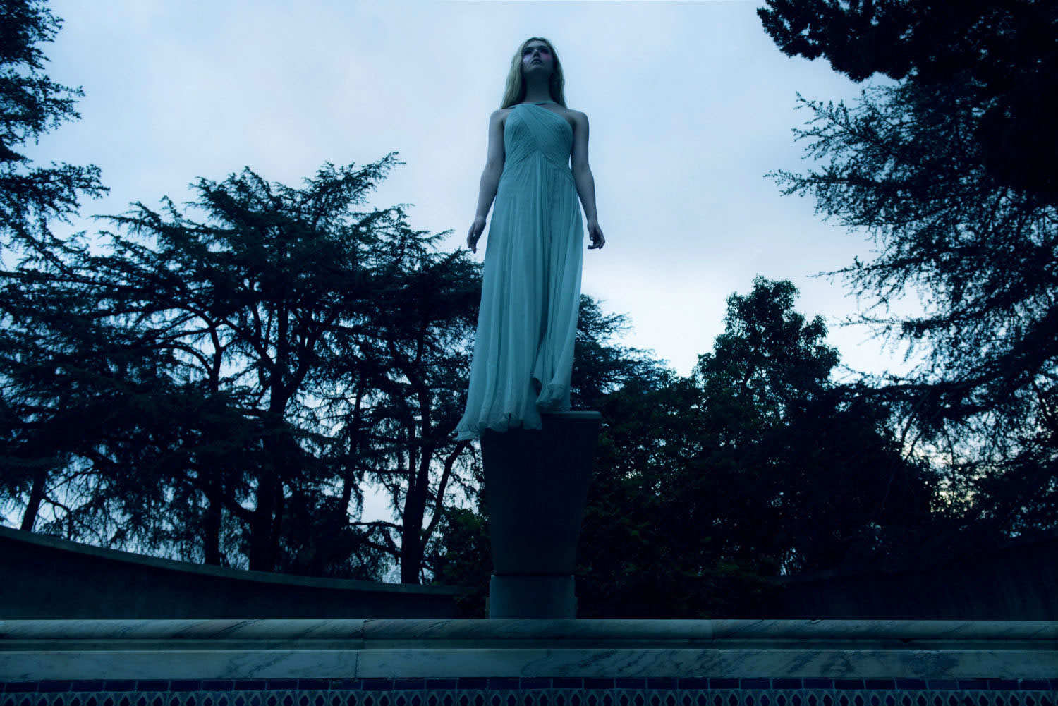 elle fanning in white dress, blue lighting