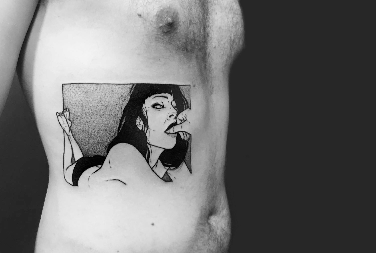 woman lying on stomach, tattoo