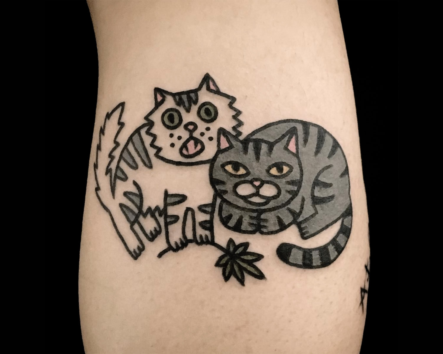 two cats, cartoon style tattoo