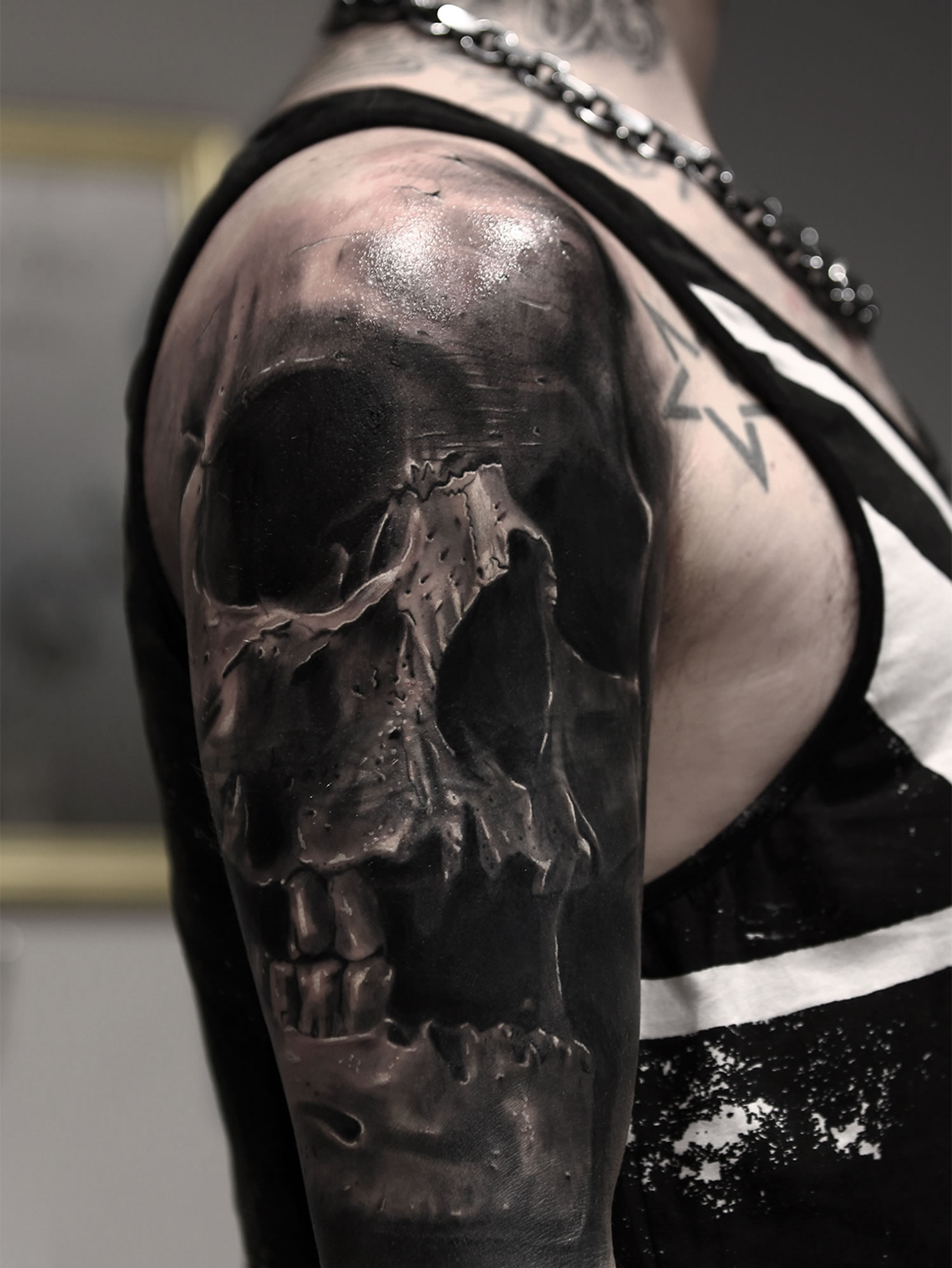 realistic skull tattoo on arm by silvano fiato