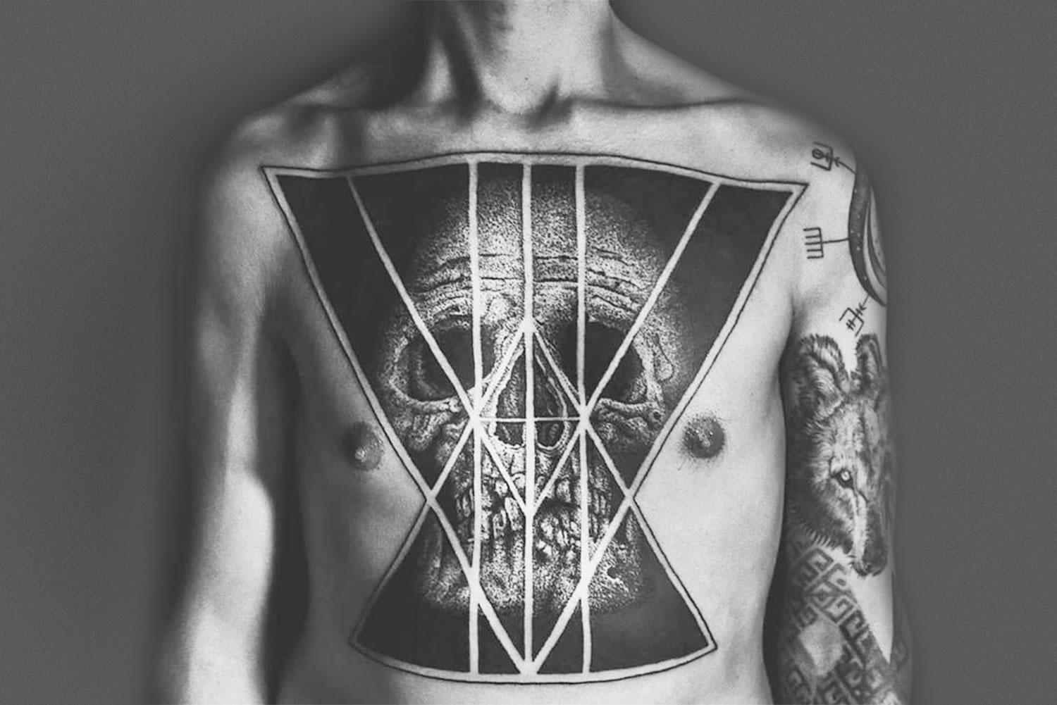 skull tattoo on chest by placide avantia