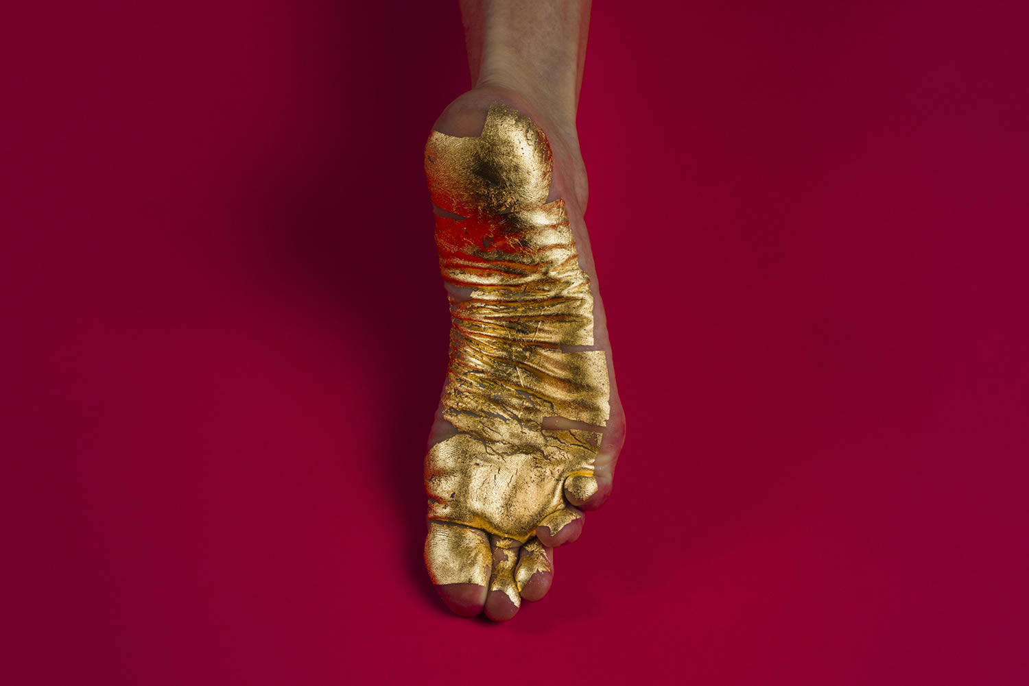 gold painted foot, photography