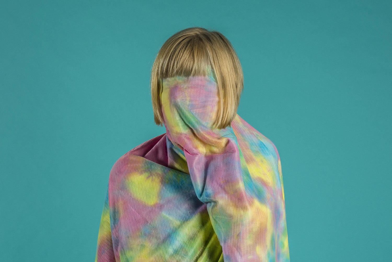 pastel camouflage cloth over human body