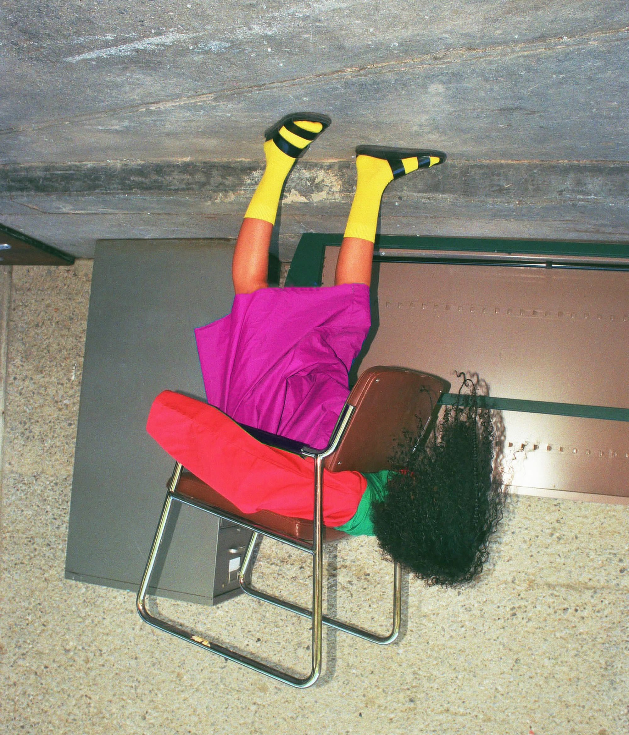 coloful dressed girl, upside down, photography