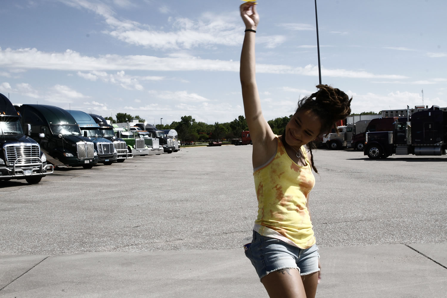 girl with hand in air, truck stop, american honey