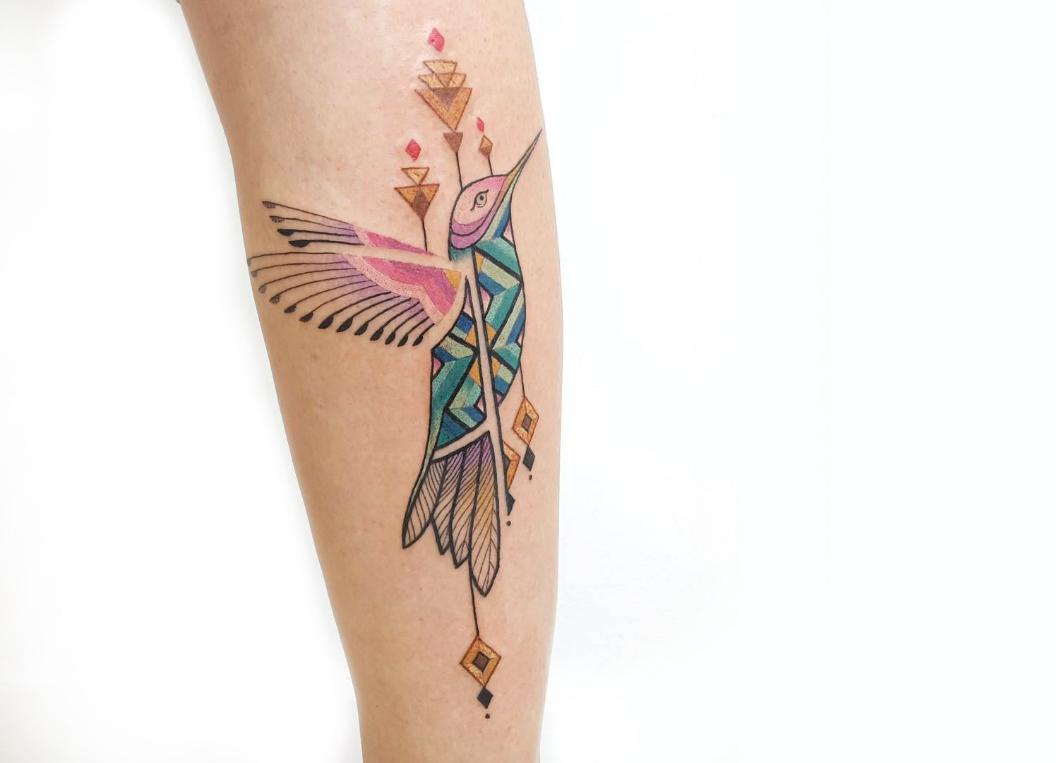 Brian Gomes geometric hummingbird tattoo