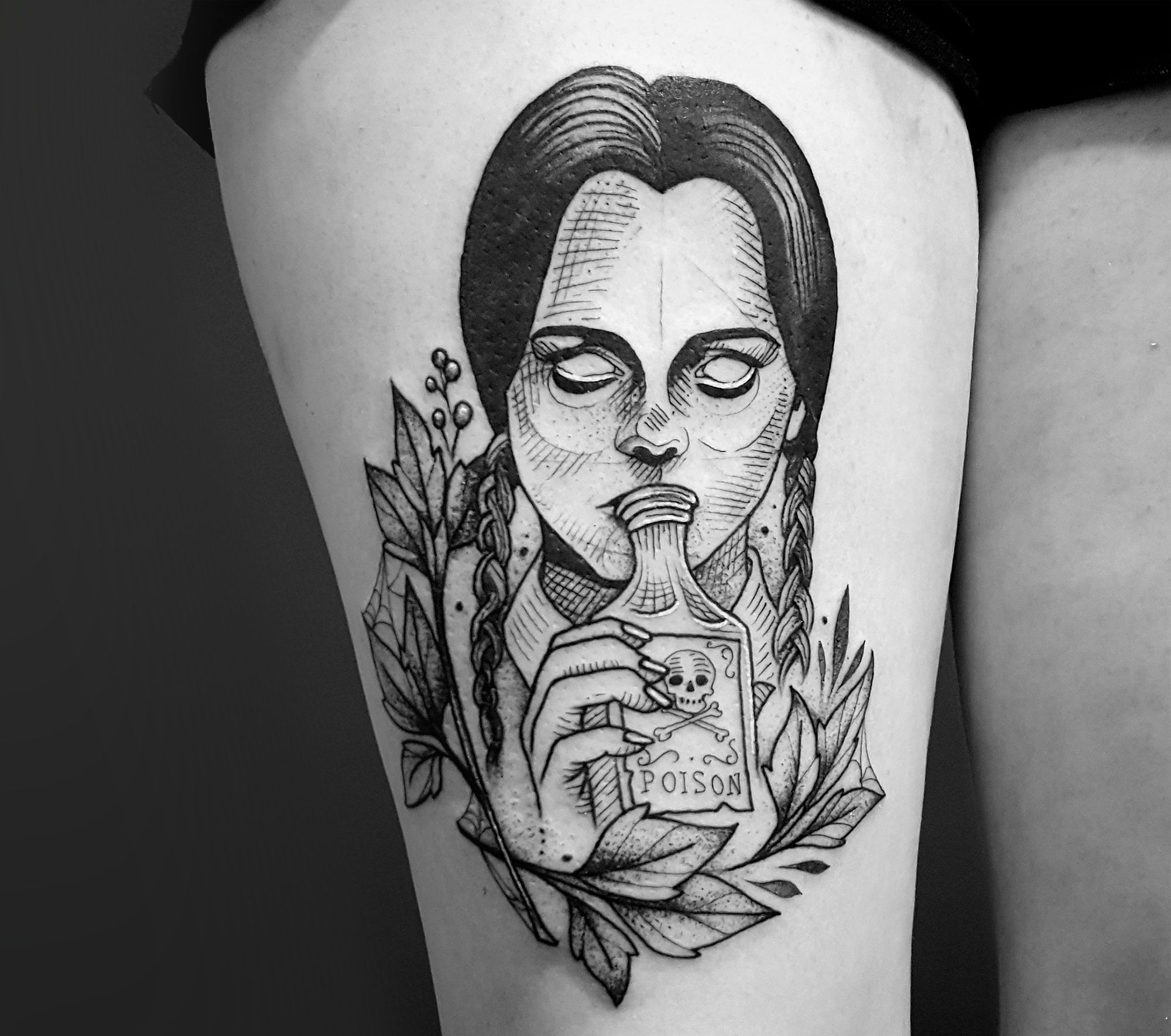 wednesday addams drinking poison, black ink tattoo on thigh